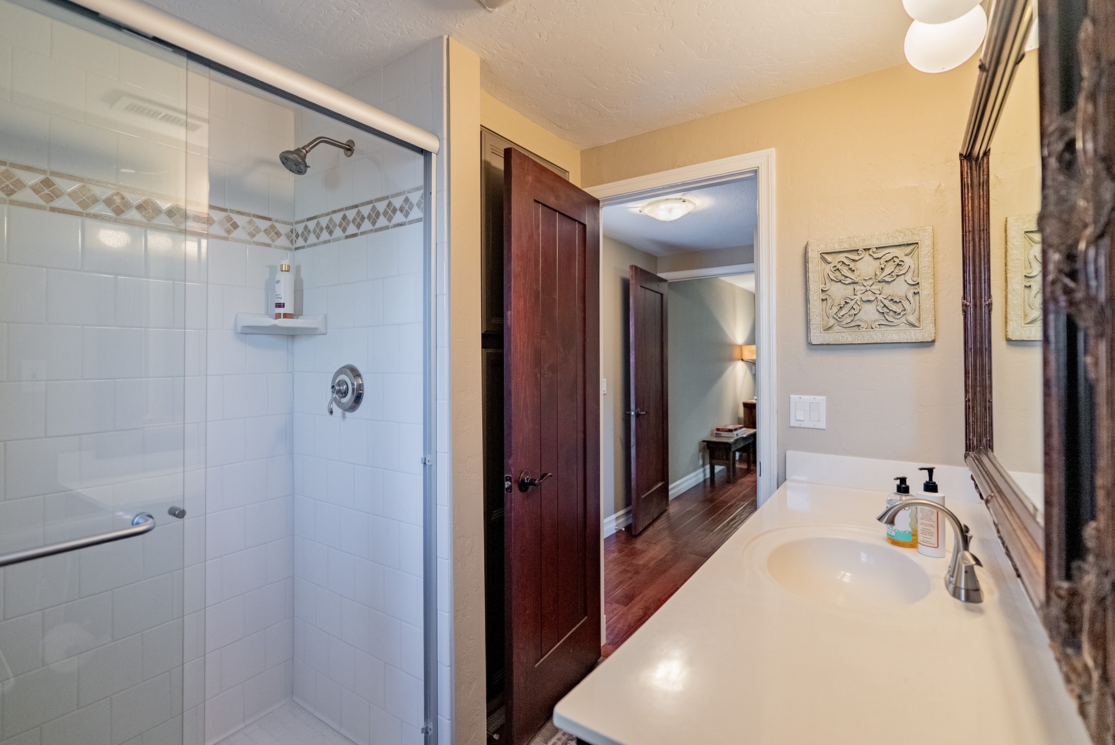 Your private bathroom features a walk-in shower and a spacious vanity
