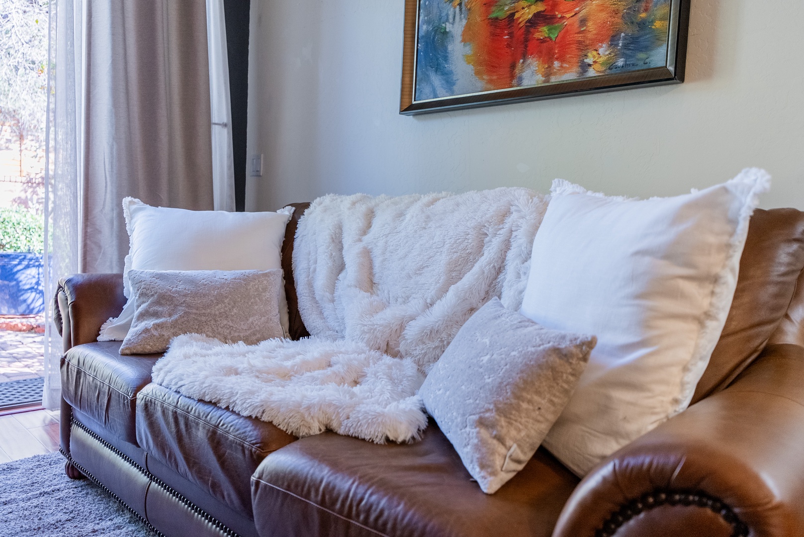 Sink into this sofa and snuggle with cozy pillows