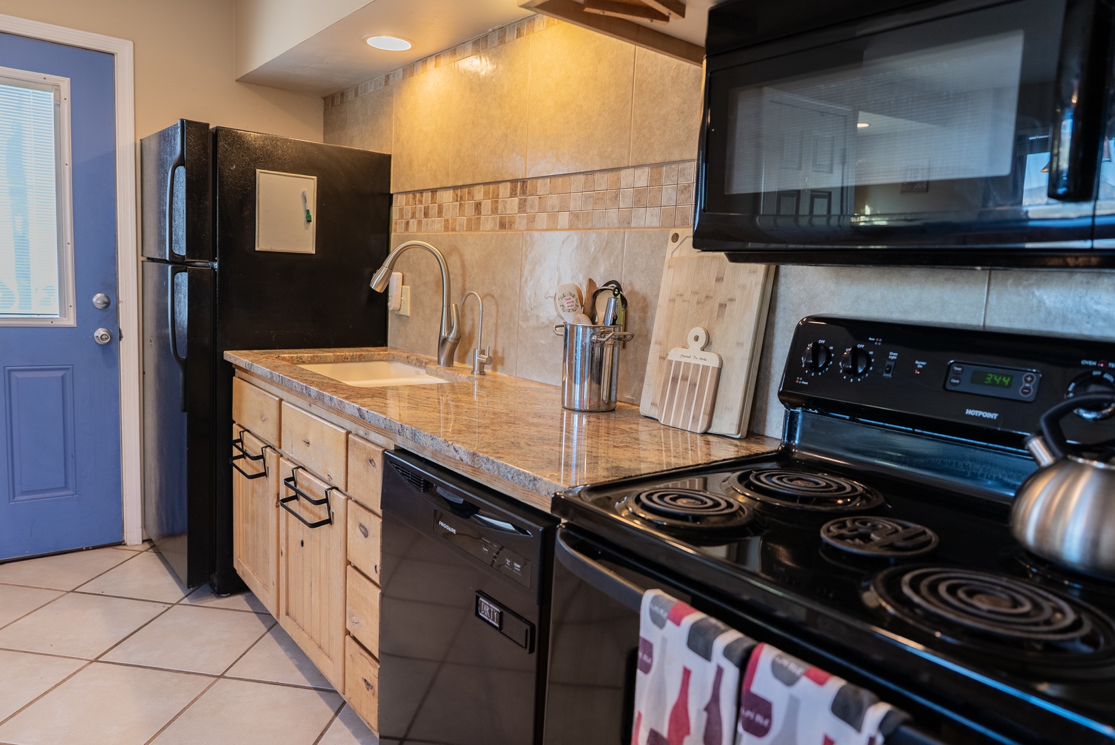 Your fully equipped kitchen features granite countertops, modern appliances, and everything you need to prepare delicious meals during your stay.