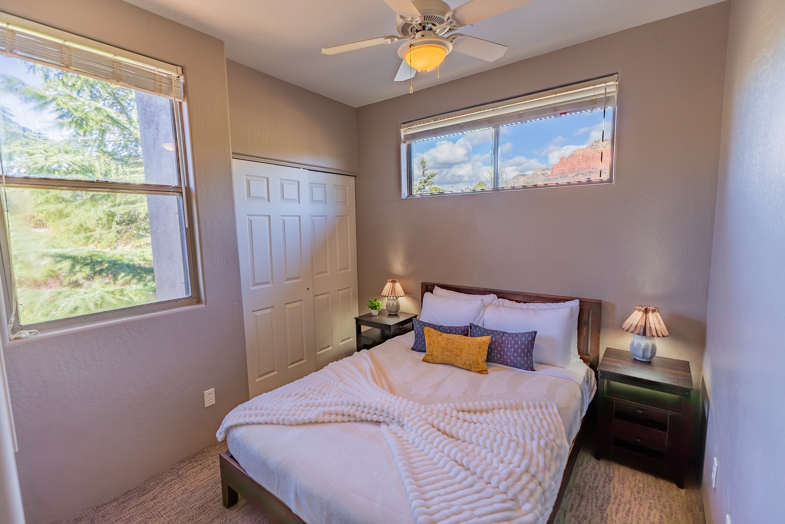 Inviting linens and stunning red rock views framed by your bedroom windows