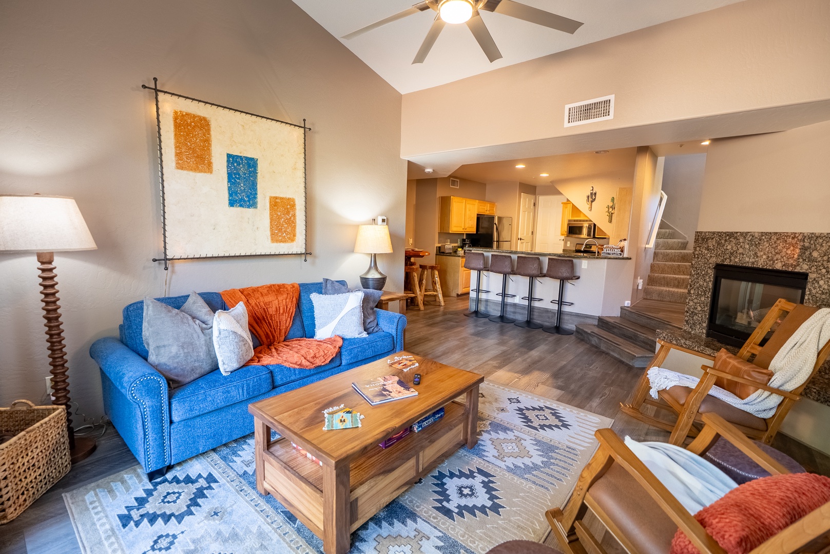 Relax in your stylish open-concept living space with sleeper sofa, cozy fireplace, and fully-equipped kitchen just steps away.