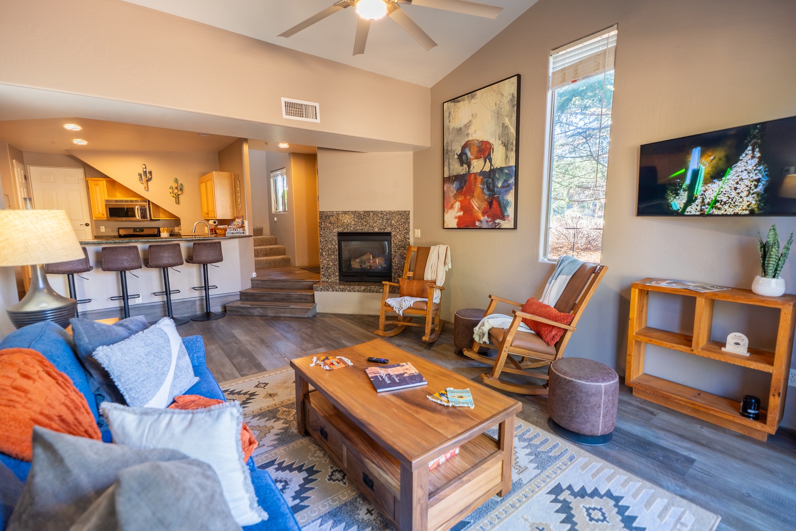 Sink into the cozy sofa and watch your favorite shows on the flat-screen TV while the fireplace warms your evening retreat.