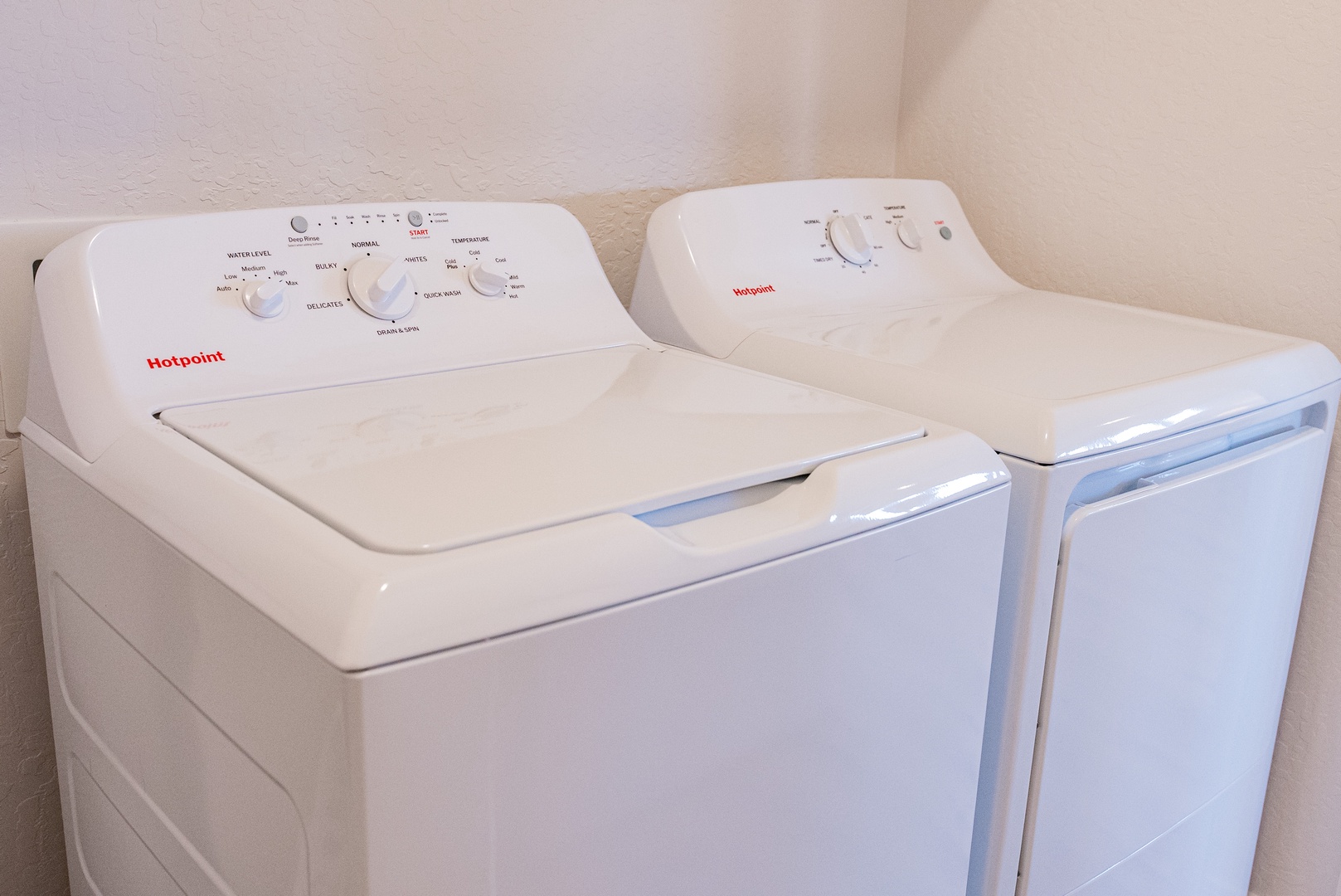 In-unit laundry featuring full-size washer and dryer.