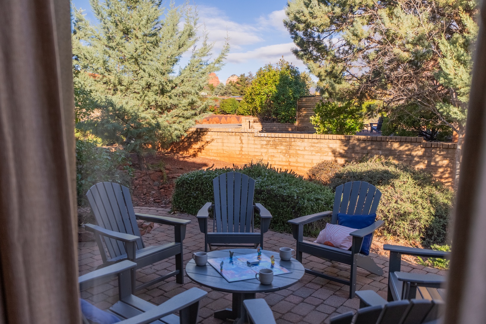 Step onto your private patio for morning coffee surrounded by mature trees and peaceful garden views.