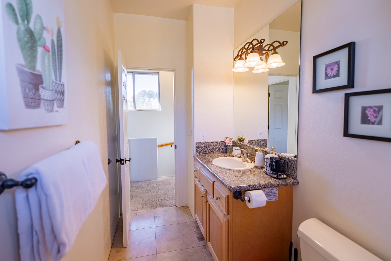 Refresh in your private bathroom featuring granite counters, elegant lighting, and thoughtful amenities.