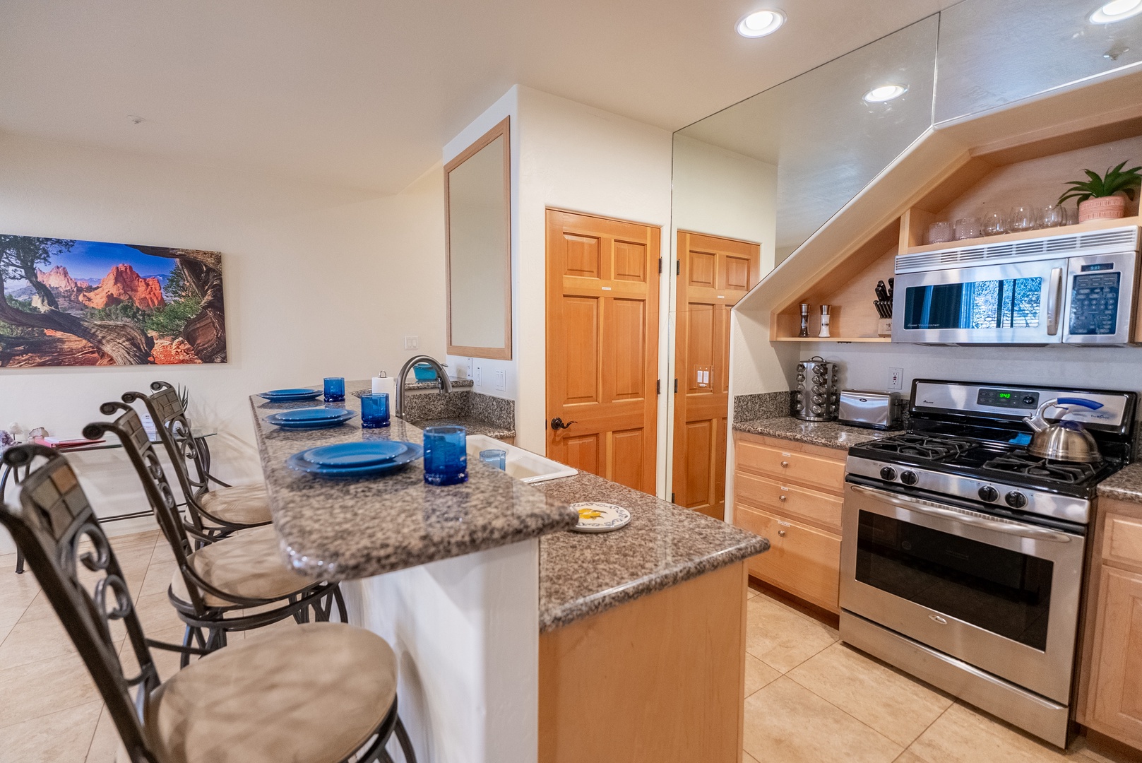 Your fully equipped kitchen features granite countertops, stainless appliances, and breakfast bar seating for memorable meals together.