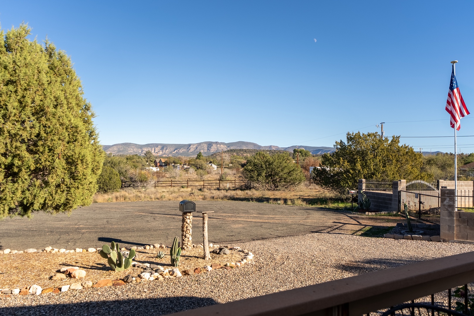 Peaceful desert landscape with distant mountains and sparse vegetation characteristic of the southwestern region