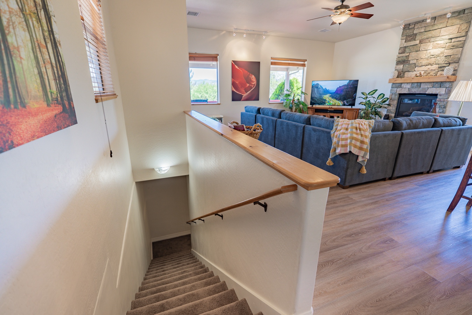 Gather in your spacious living room featuring plush seating, mountain views, and a cozy fireplace for perfect evenings together.