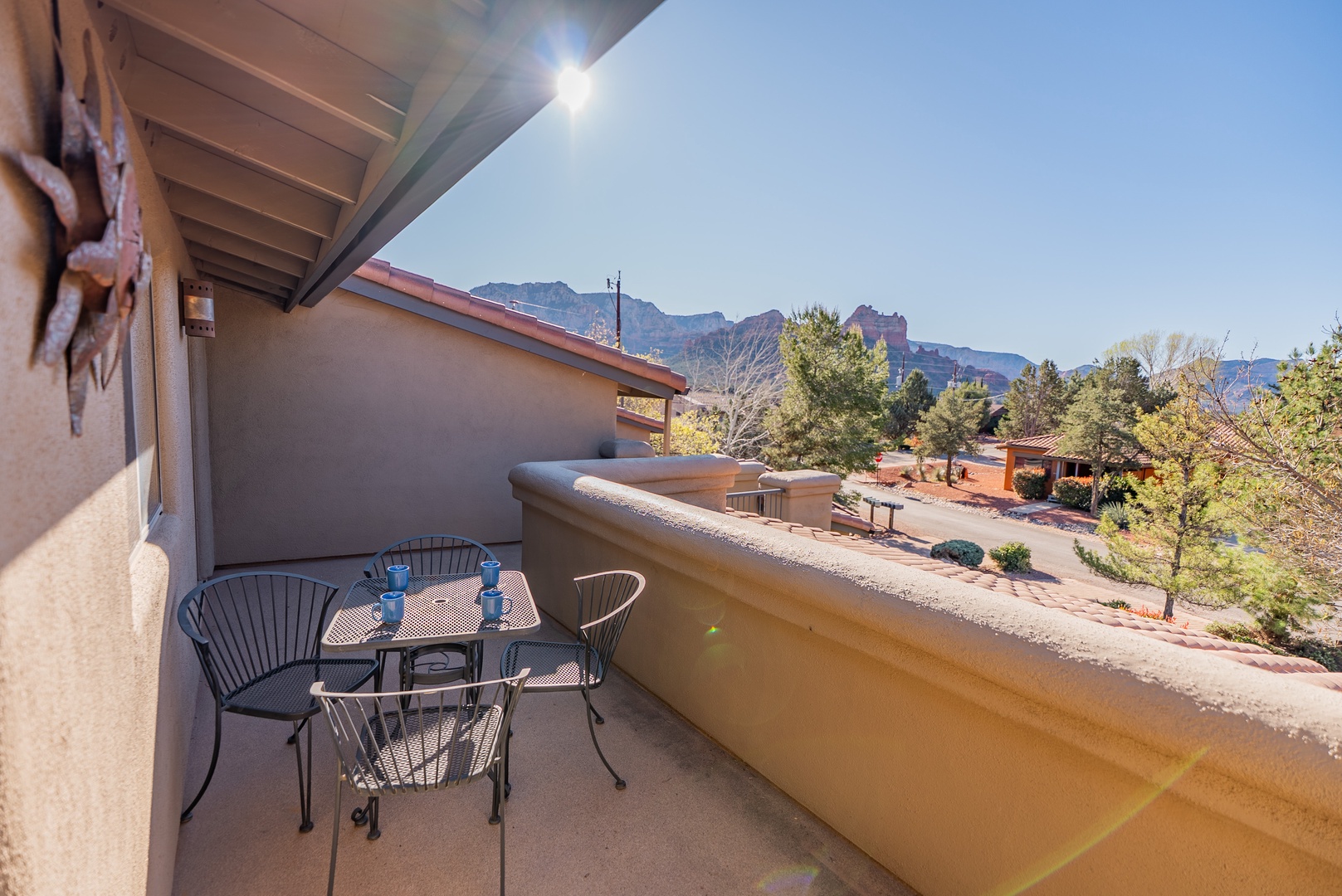 A private balcony spans the front of the home