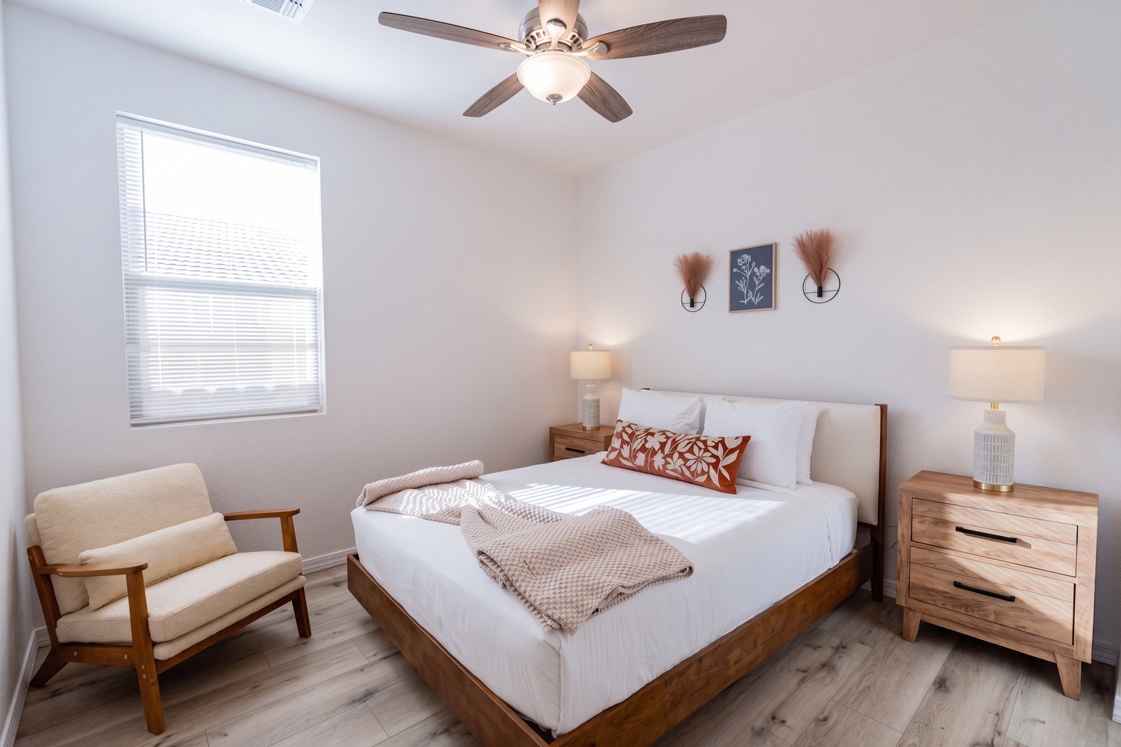 Crisp white linens and warm wood tones in serene bedroom