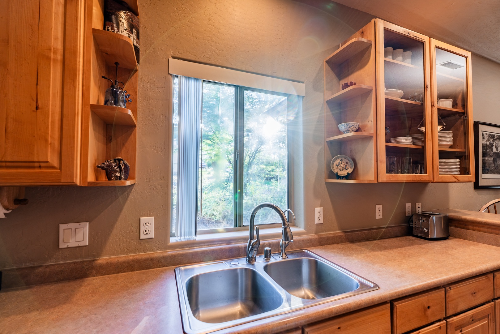 Galley style kitchen has relaxing back yard views