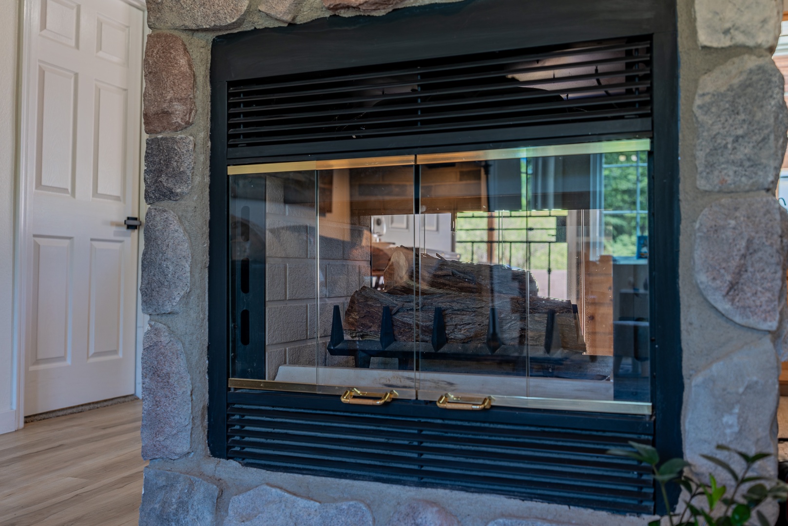 Dual sided wood fireplace is cozy and warm when it is chilly.