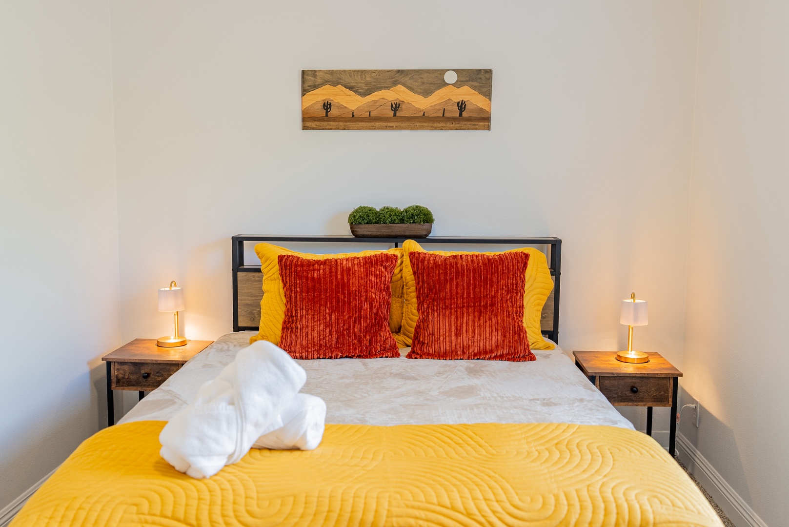 Vibrant accents and warm lighting with ceiling fans