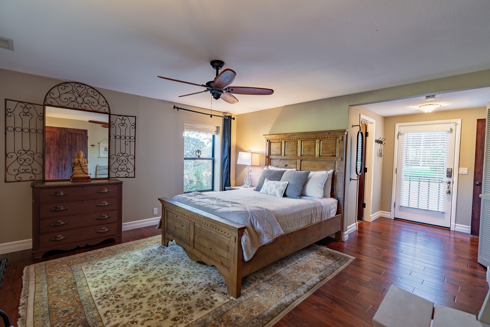 Spacious bedroom features a plush Queen bed