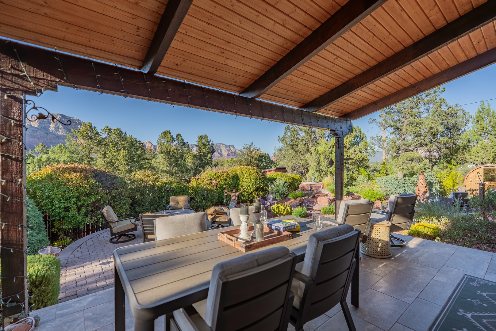 Covered patio with mountain views, outdoor dining, a perfect spot