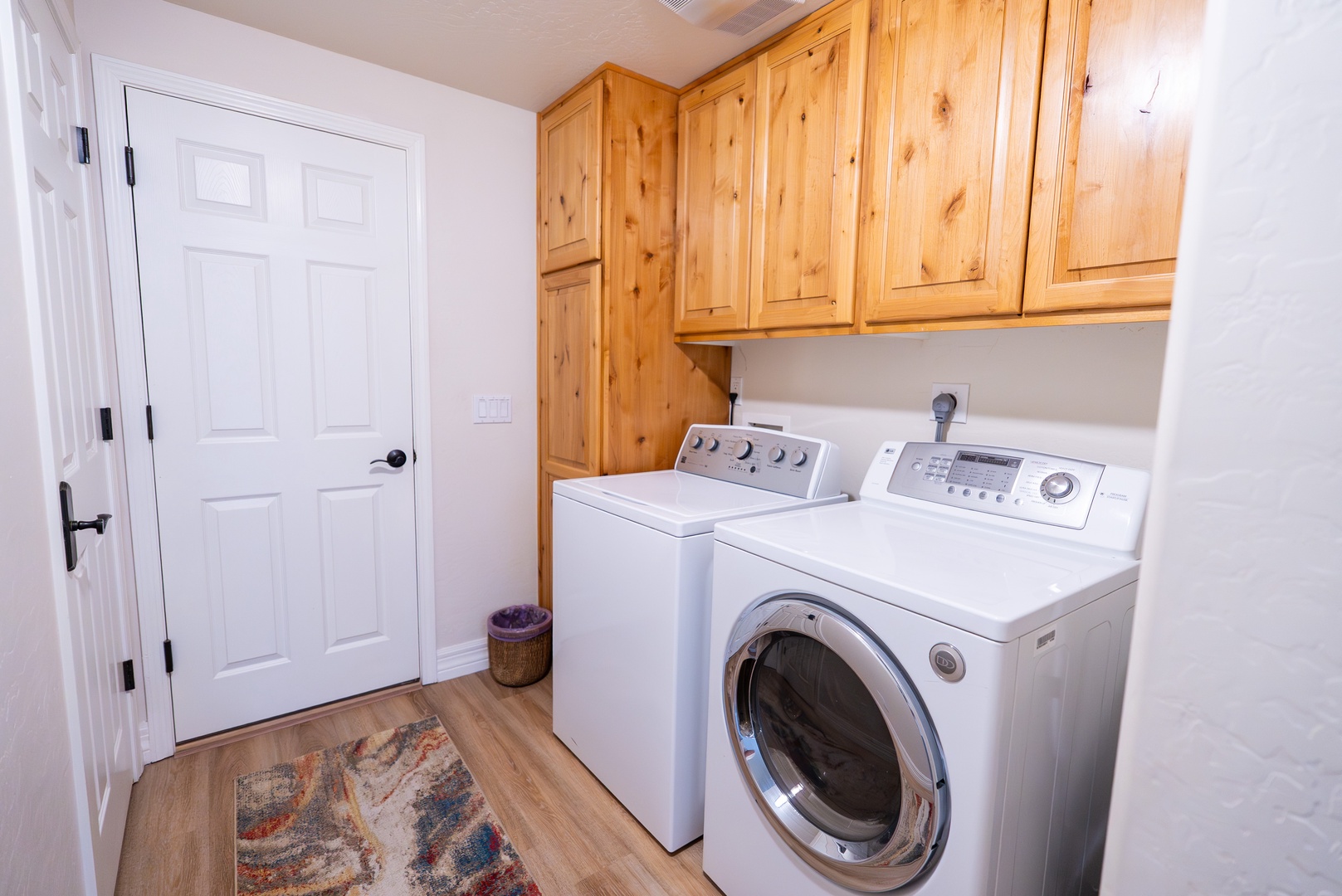 Your dedicated laundry room features full-size washer and dryer with ample cabinet storage for all your travel essentials.