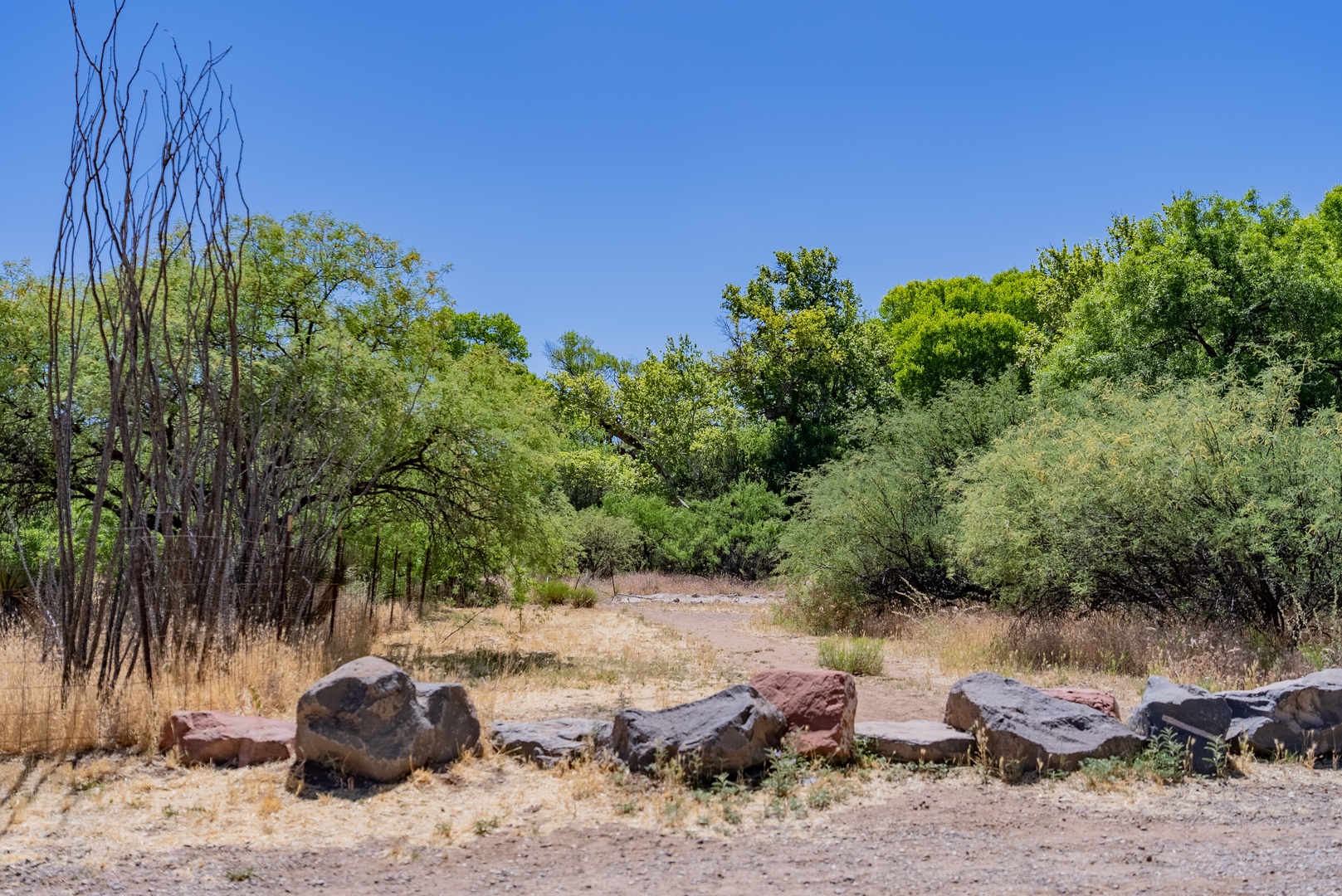 Diagonal from the property is a walking path to the river and trails