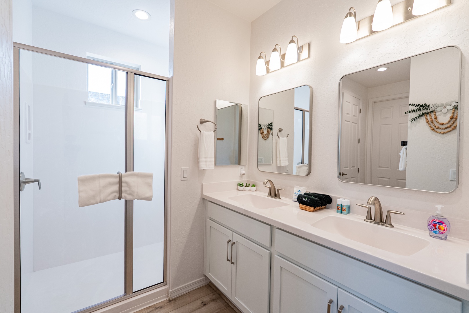 Refresh in your bright bathroom featuring dual sinks