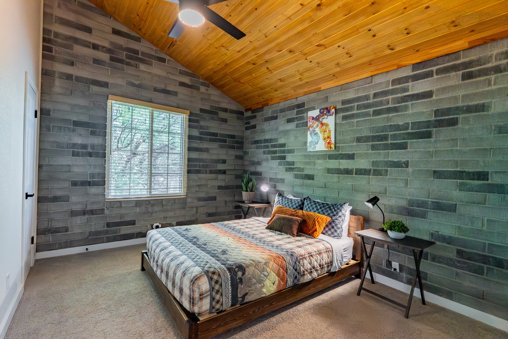 Second bedroom features Queen bed and television