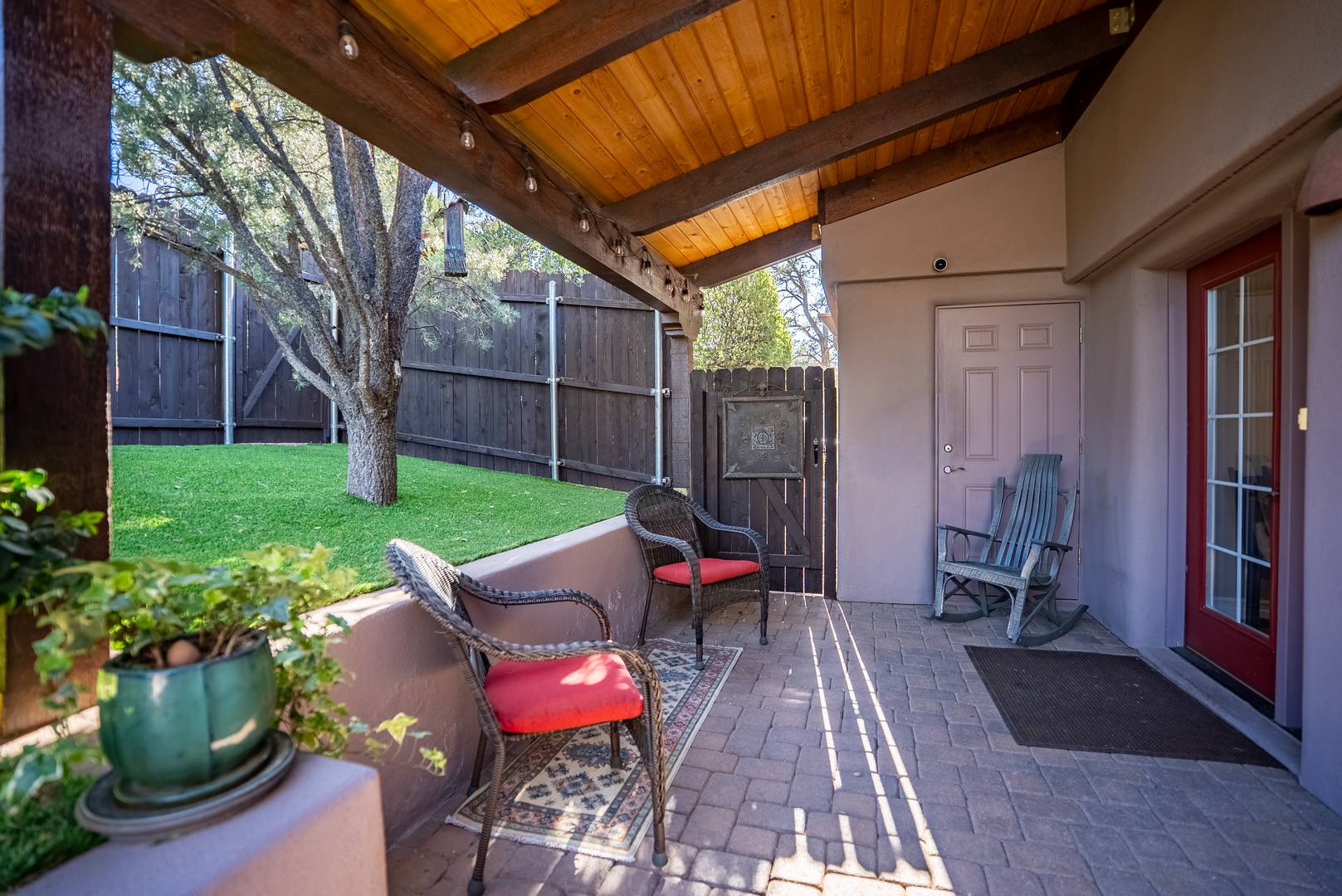 Side covered patio is just another place to relax and read a book.