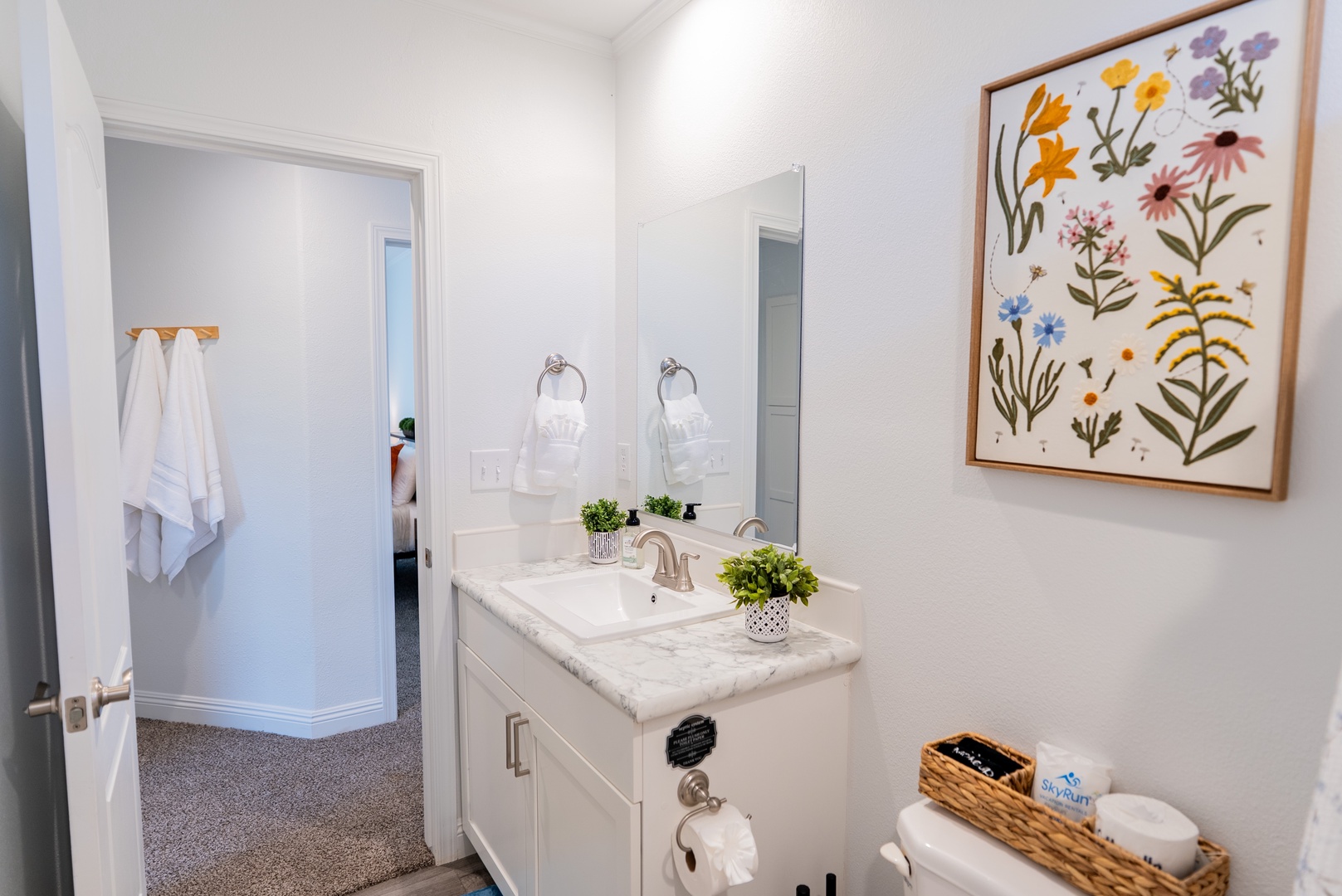 Bright, cheerful bathroom with soft towels.
