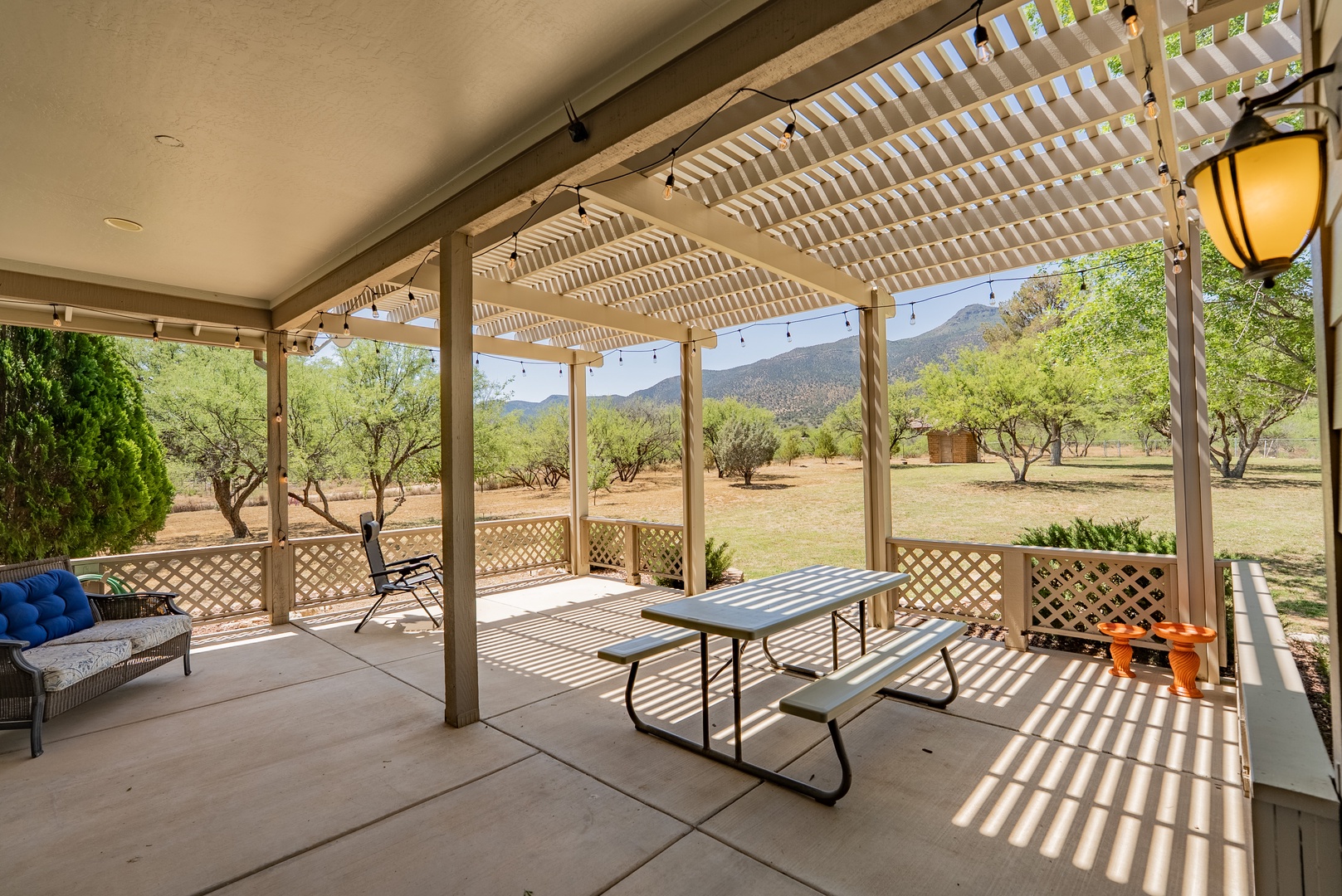 Your covered patio offers peaceful mountain views and comfortable seating where you can dine al fresco or simply relax in nature's embrace.