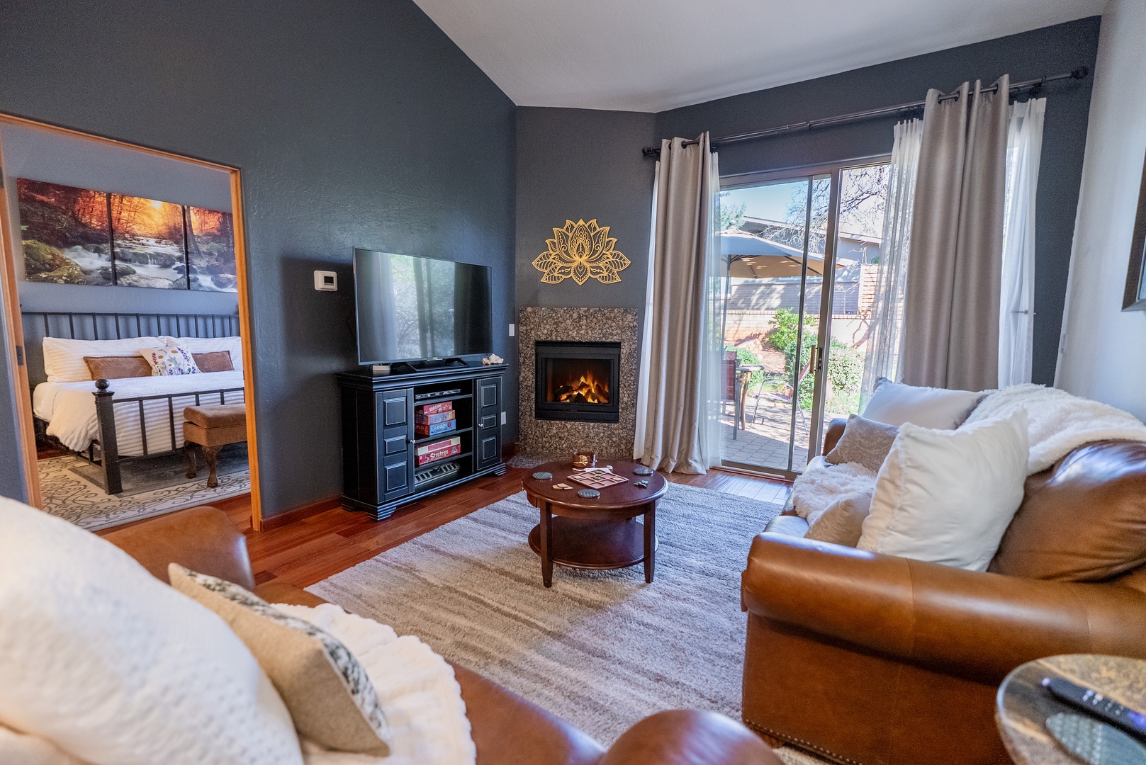 Cozy up in your spacious living room with leather seating, warm fireplace, and entertainment center—perfect for relaxing after exploring.