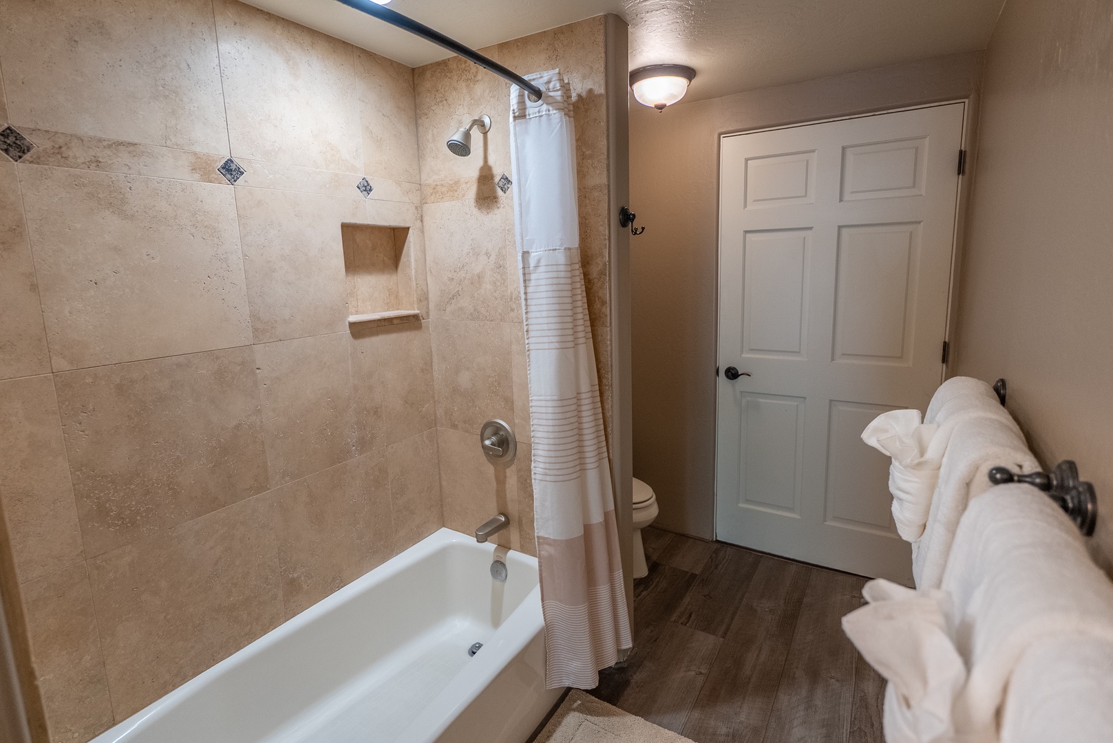 Warm travertine tiling, and soft, fluffy towels.