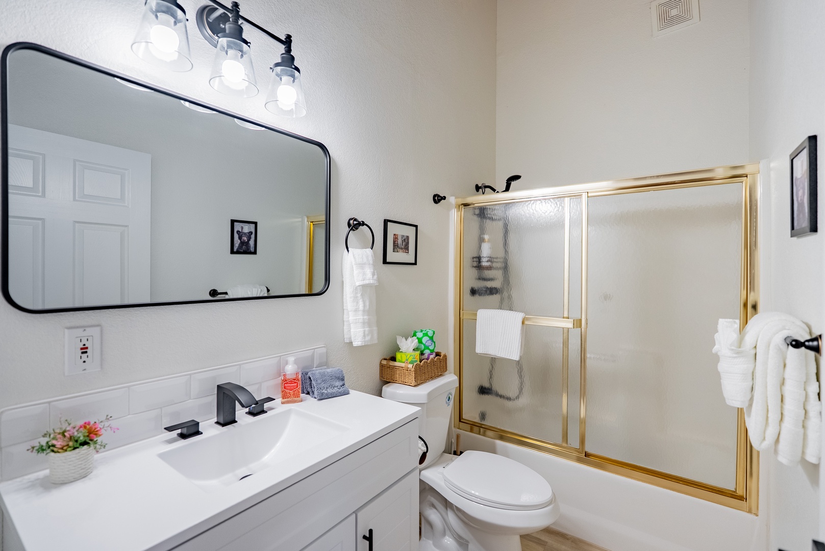 Guest bath is spacious with soaring ceilings.