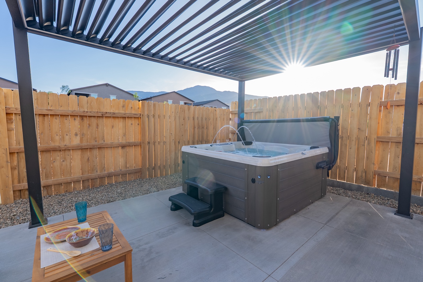 Relieve stress in your private hot tub under a modern pergola