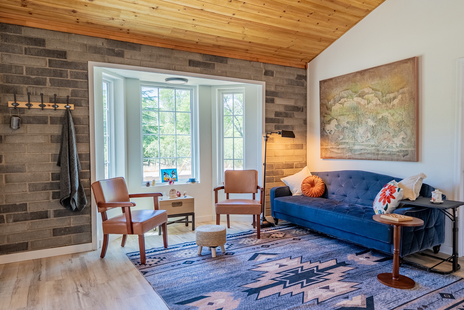 Cozy living room with bay window and fireplace