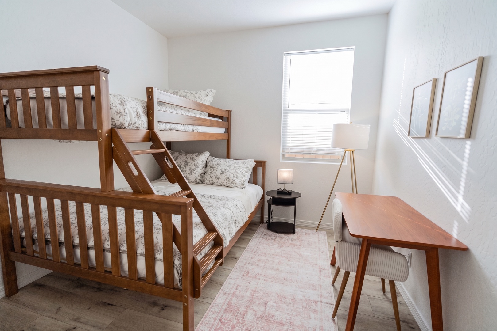 Your kids will love this bright bedroom with sturdy wooden bunk beds