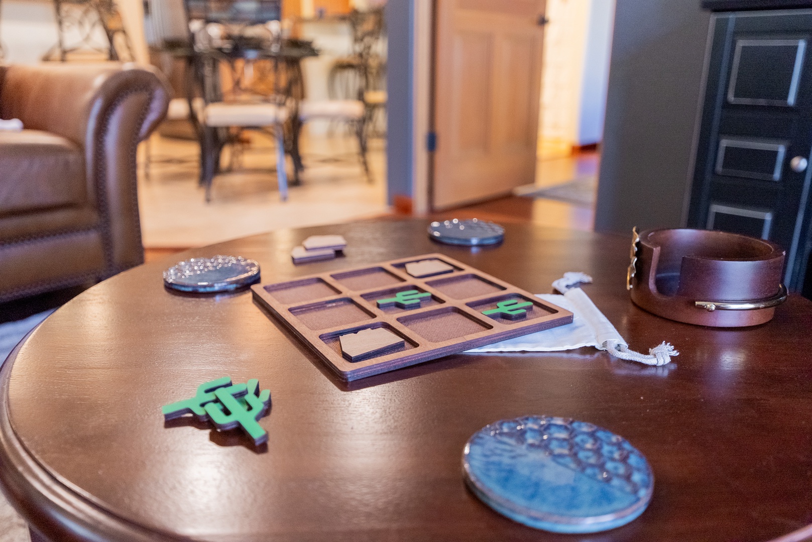 Gather around this inviting table where board games await your next memorable evening with loved ones.