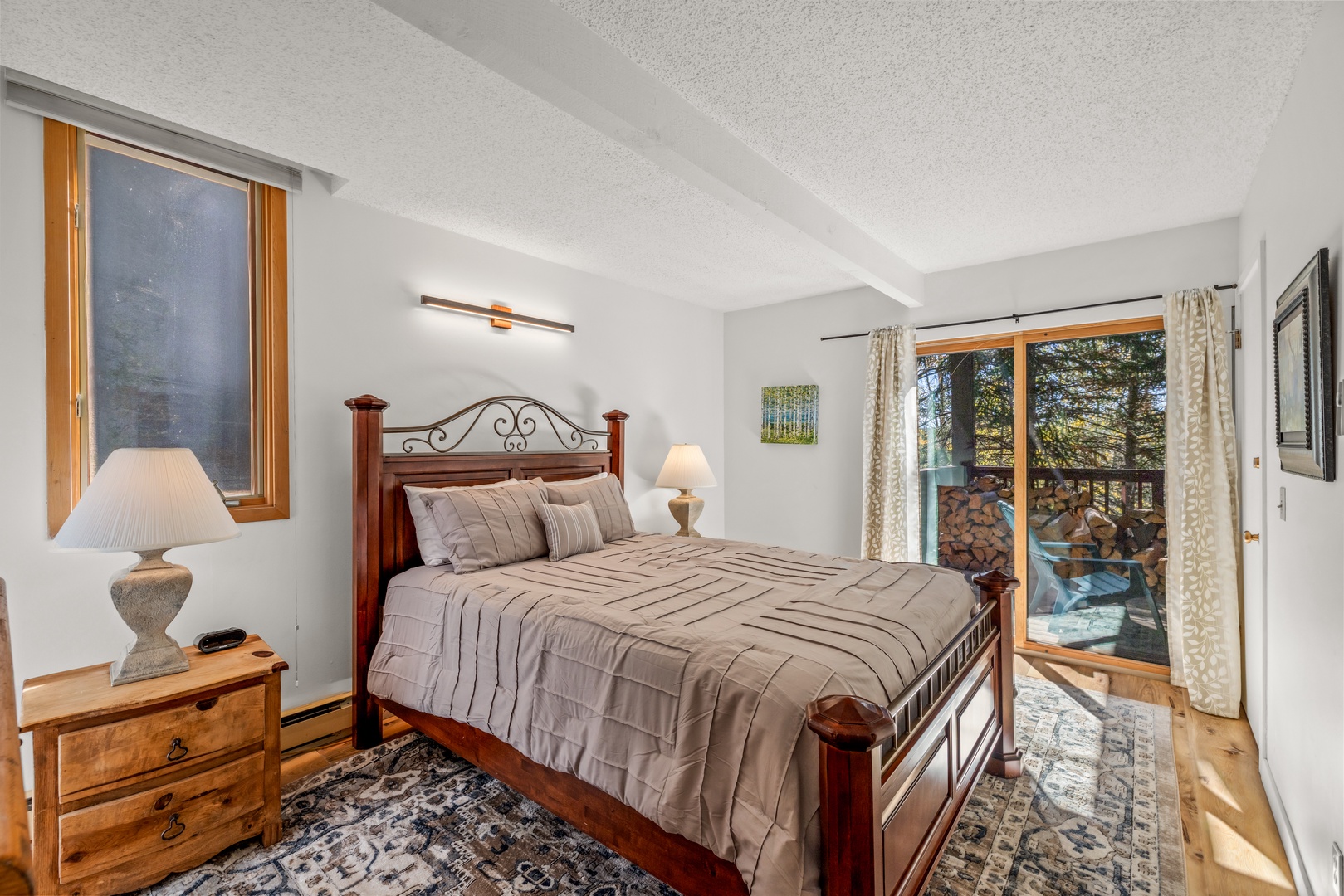 Sink into this cozy bed where warm wood tones and soft lighting set the stage for peaceful mountain mornings. Step onto your private balcony to breathe in the crisp alpine air.