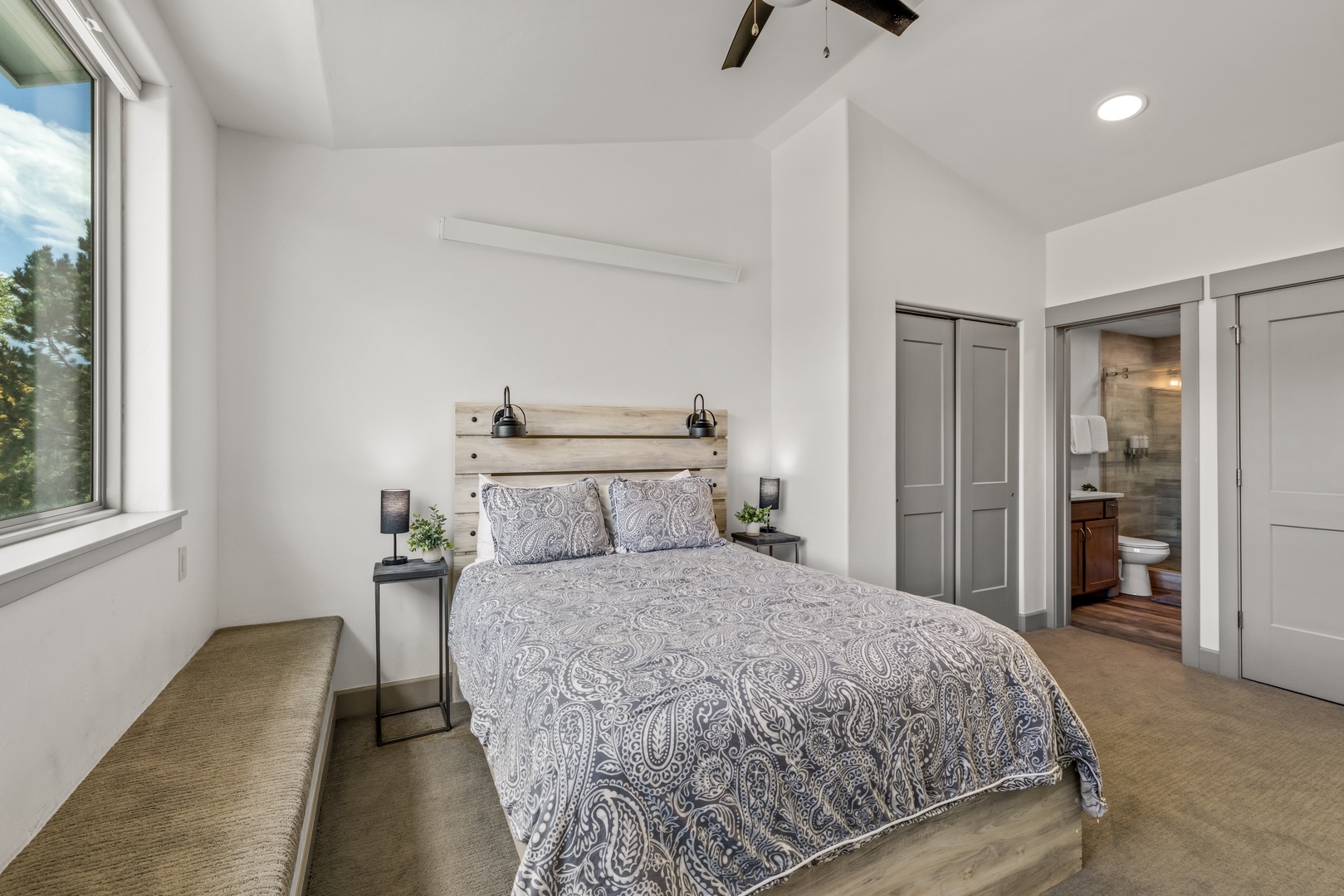 Step into your peaceful retreat, where tall ceilings and soft natural light create an airy escape. Rest easy in this thoughtfully designed bedroom, complete with an ensuite bath for your comfort.