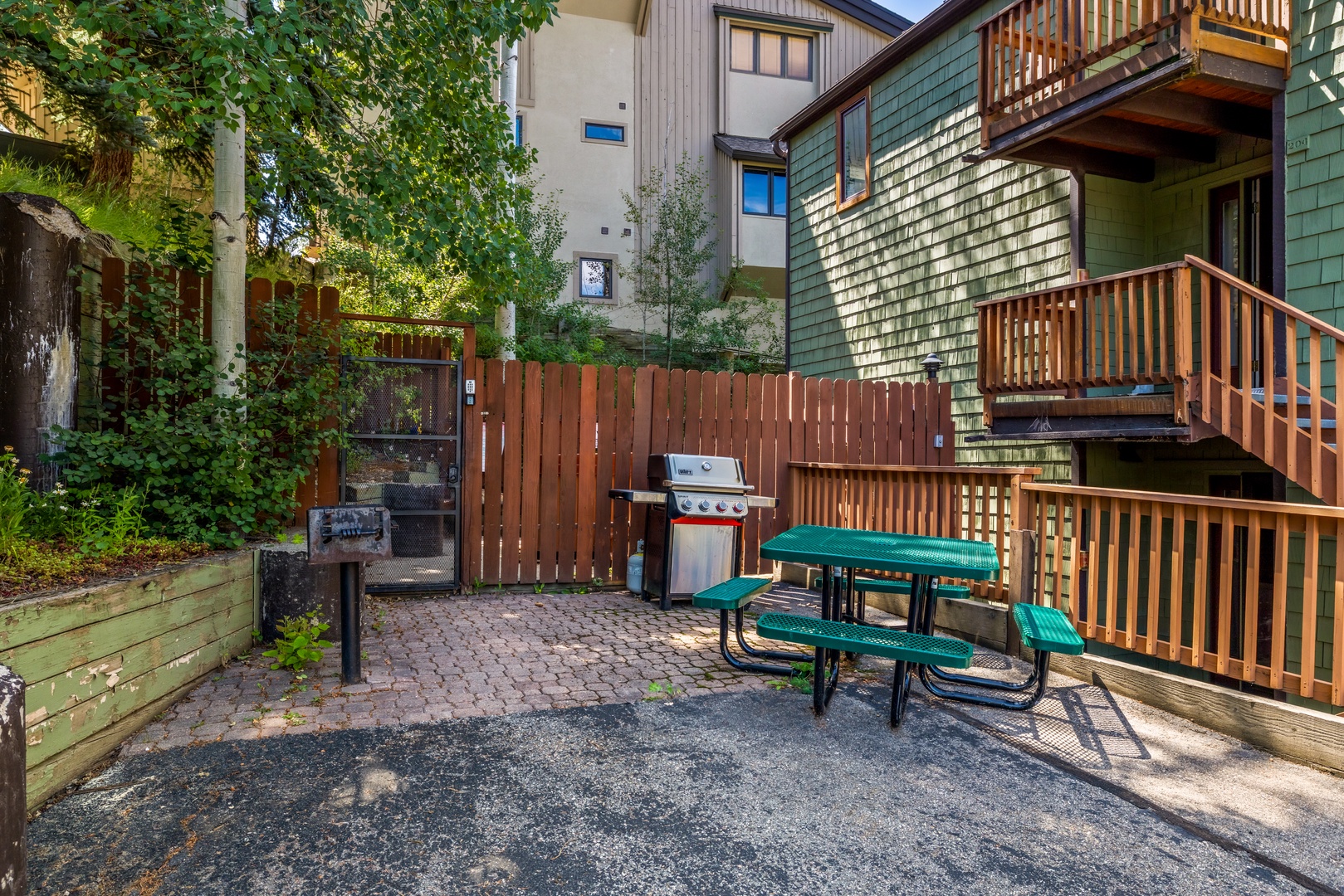 Your own private outdoor space awaits with a picnic table, grill, and sunny patio—perfect for morning coffee or evening meals surrounded by mountain air.