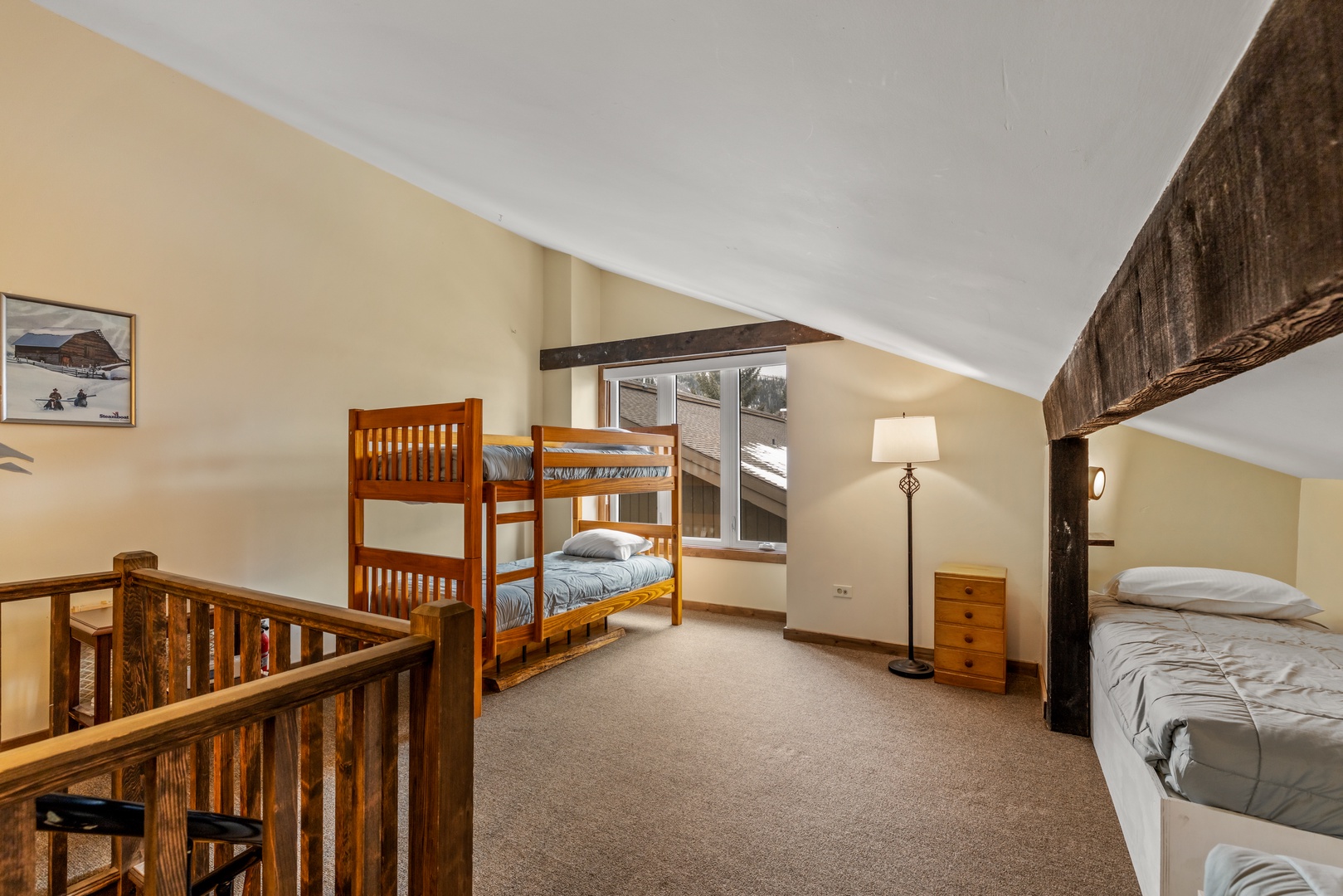 Your cozy loft bedroom combines rustic charm with comfortable sleeping arrangements, perfect for families or groups sharing memorable mountain getaways together.