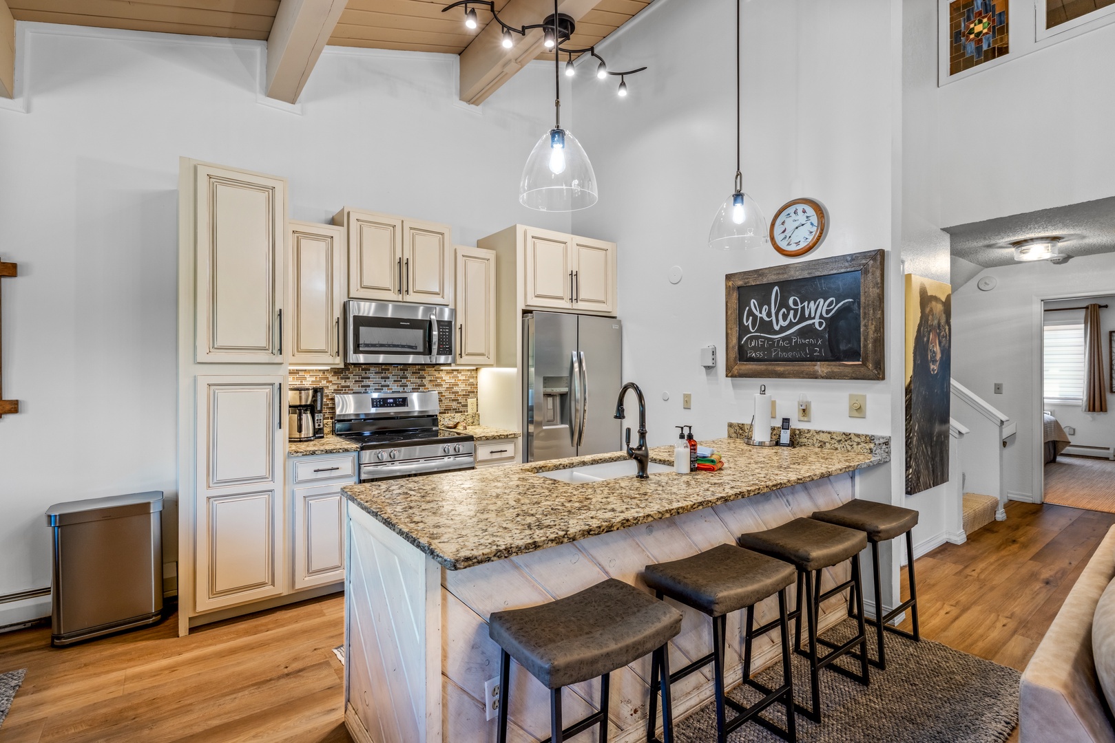 Your fully equipped kitchen invites culinary adventures with granite countertops, modern appliances, and a welcoming island where morning coffee or evening wine tastes even better.