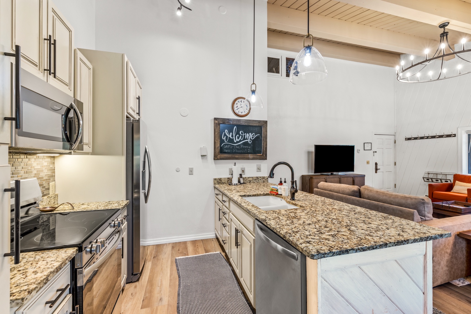 Gather around your modern kitchen island with granite counters, stainless appliances, and open-plan flow into your inviting living space—perfect for preparing meals and sharing stories.