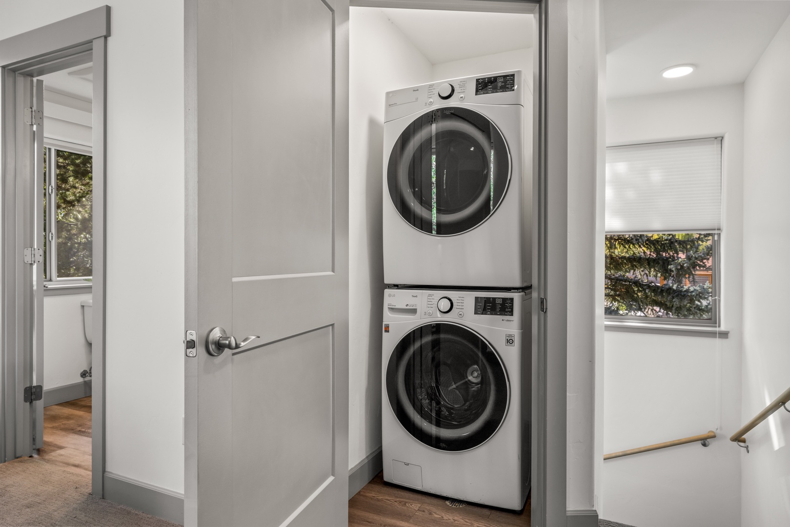 Enjoy the convenience of your own in-unit washer and dryer, tucked neatly into a dedicated alcove for easy access during your stay.