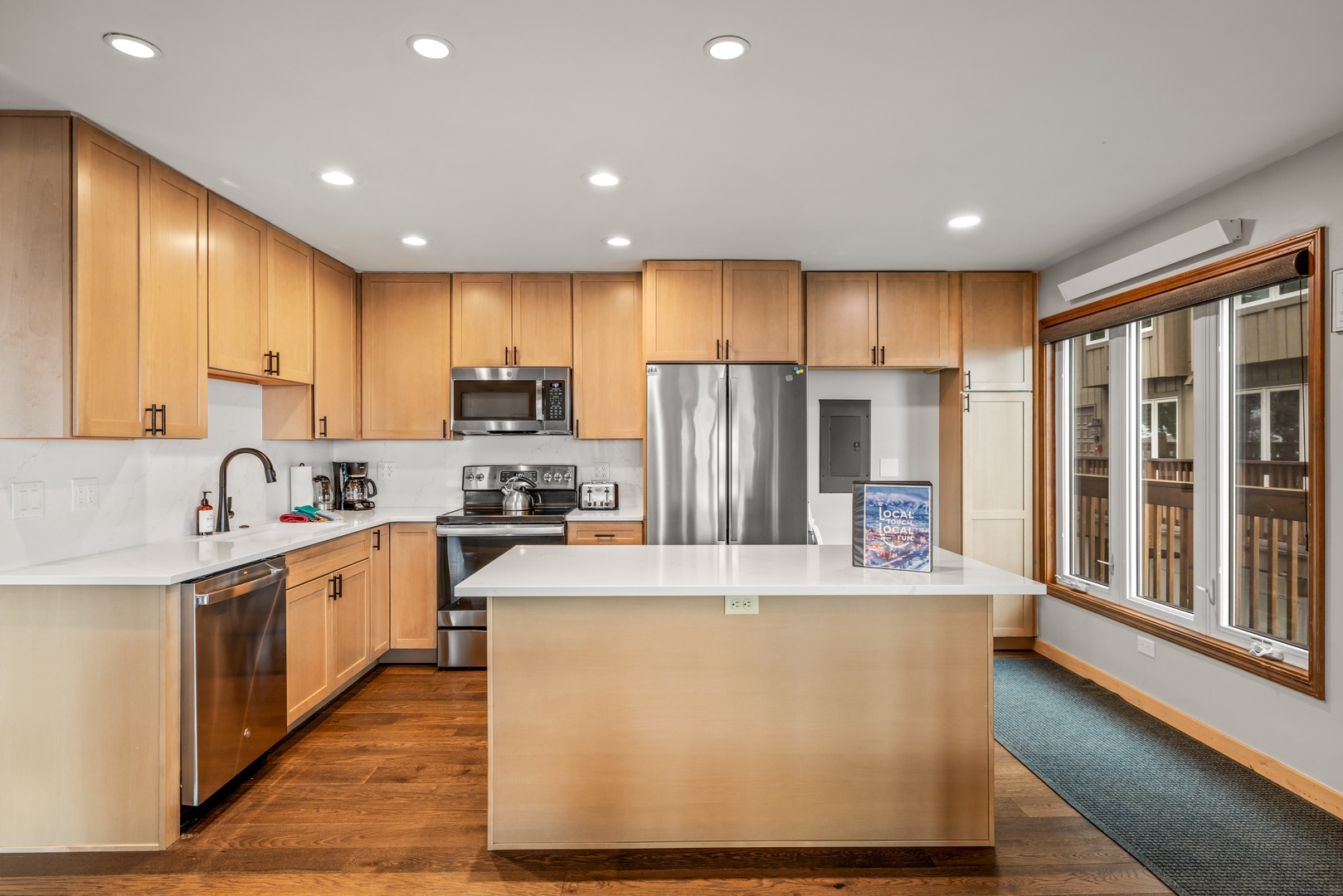 Cook your favorite meals in this spacious kitchen featuring modern appliances, plenty of counter space, and everything you need for memorable dining experiences.