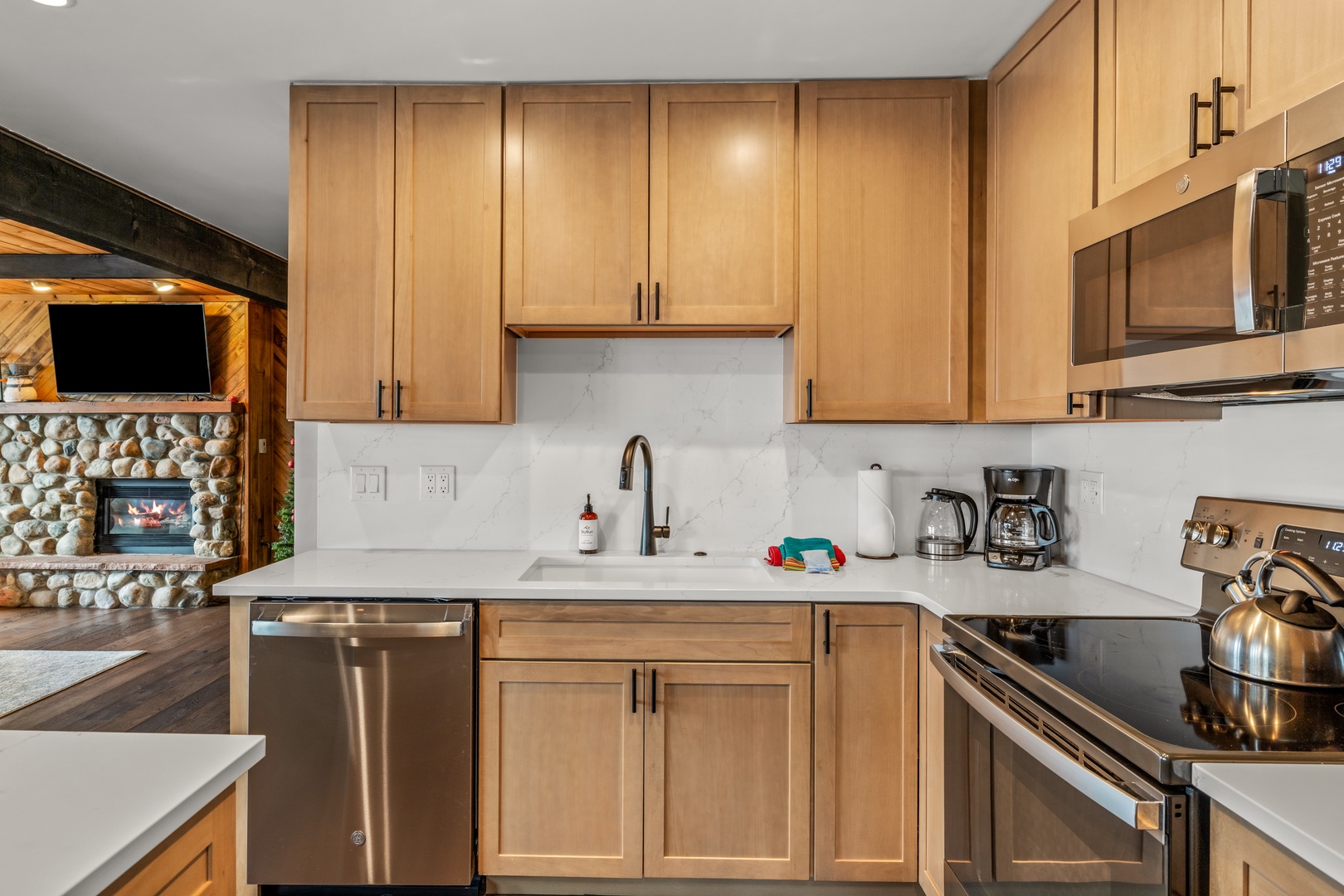 Your fully equipped kitchen features warm wood cabinets, modern appliances, and everything you need to create delicious meals during your stay.