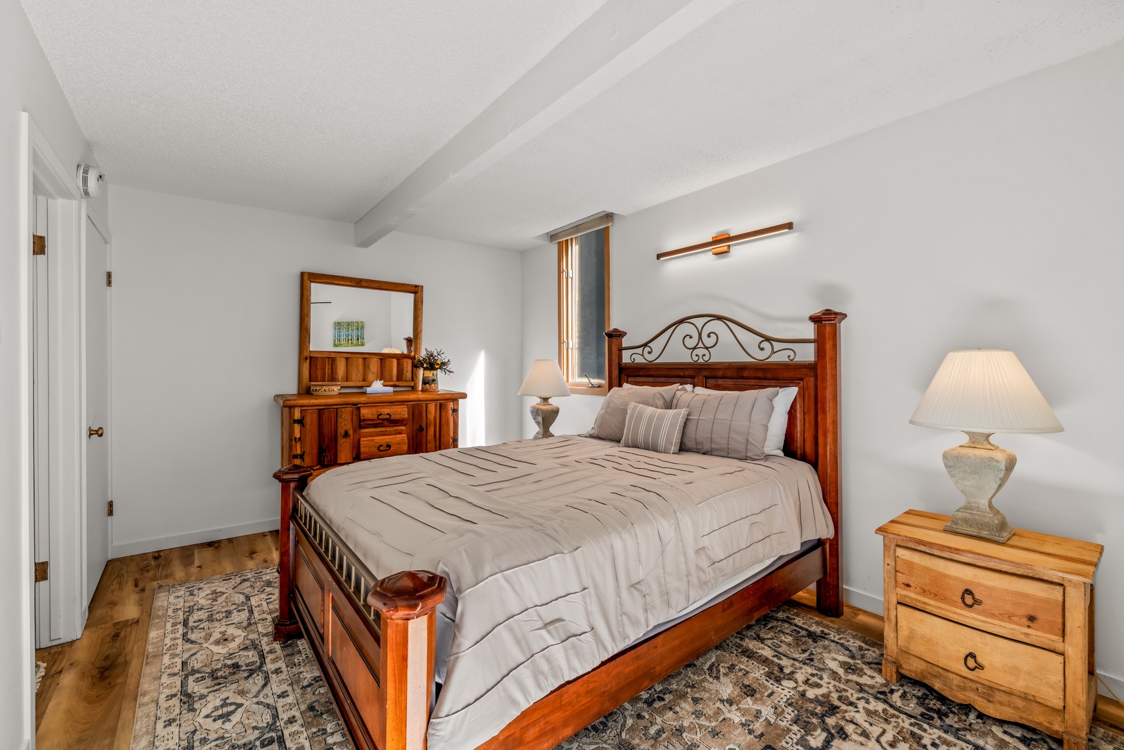 Unwind in your peaceful retreat with charming wood furnishings and soft natural light. You'll love the classic touches and cozy ambiance that make this space feel like home.