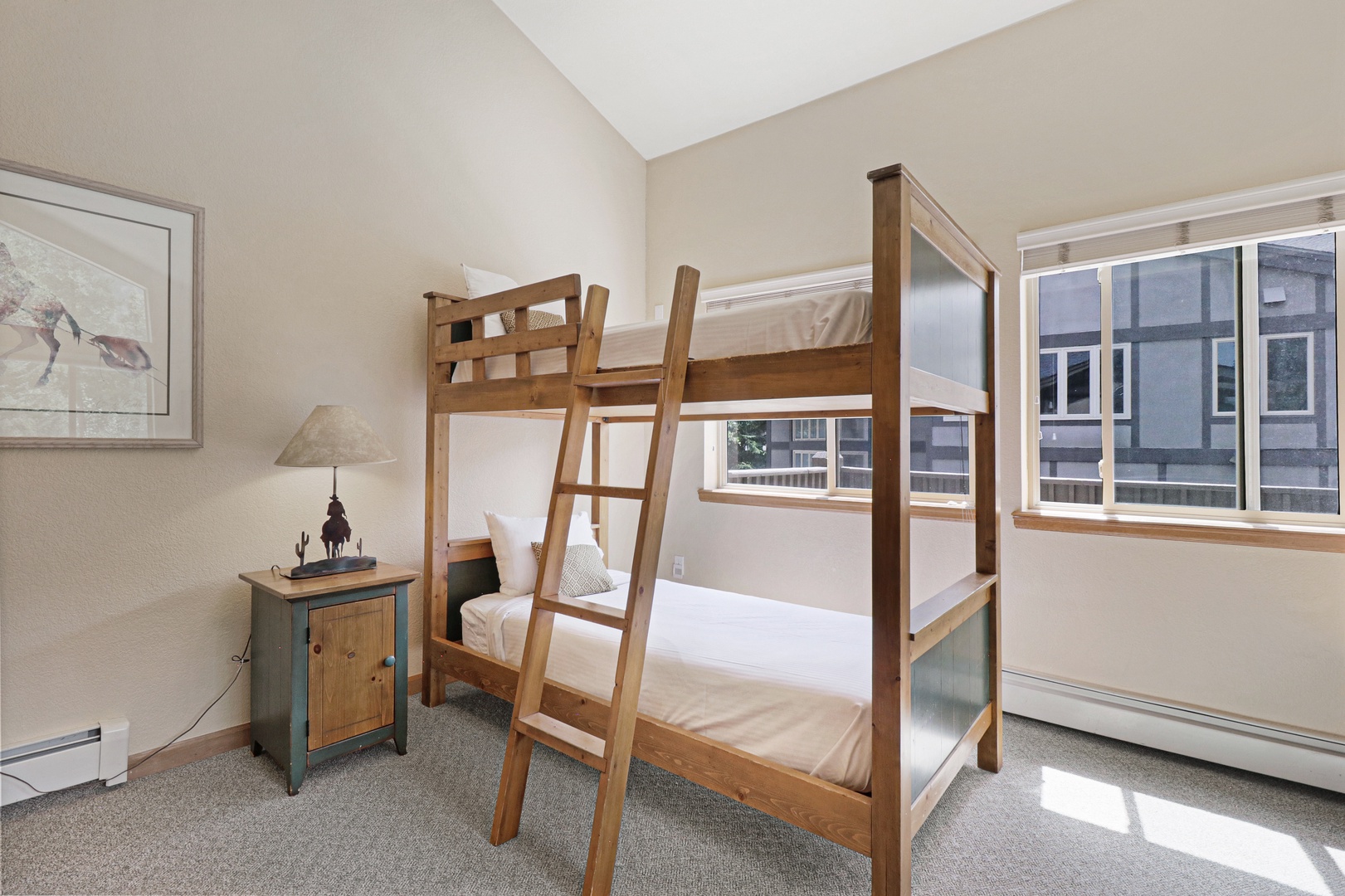 Your kids will love bunking together in this bright and cozy room, with natural light streaming through large windows and plenty of space for evening stories and giggles.