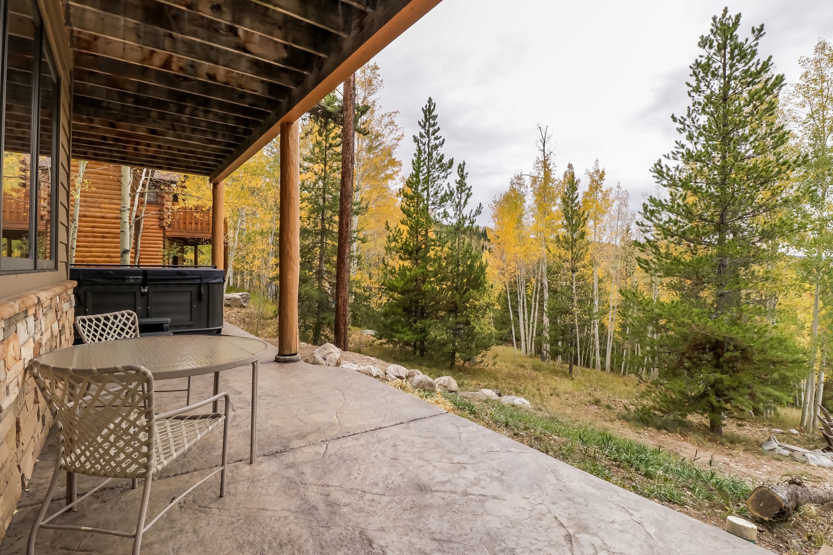 Your private covered patio opens to golden aspens and towering pines, with a hot tub ready for soaking in the crisp mountain air. Perfect autumn mornings begin right here.