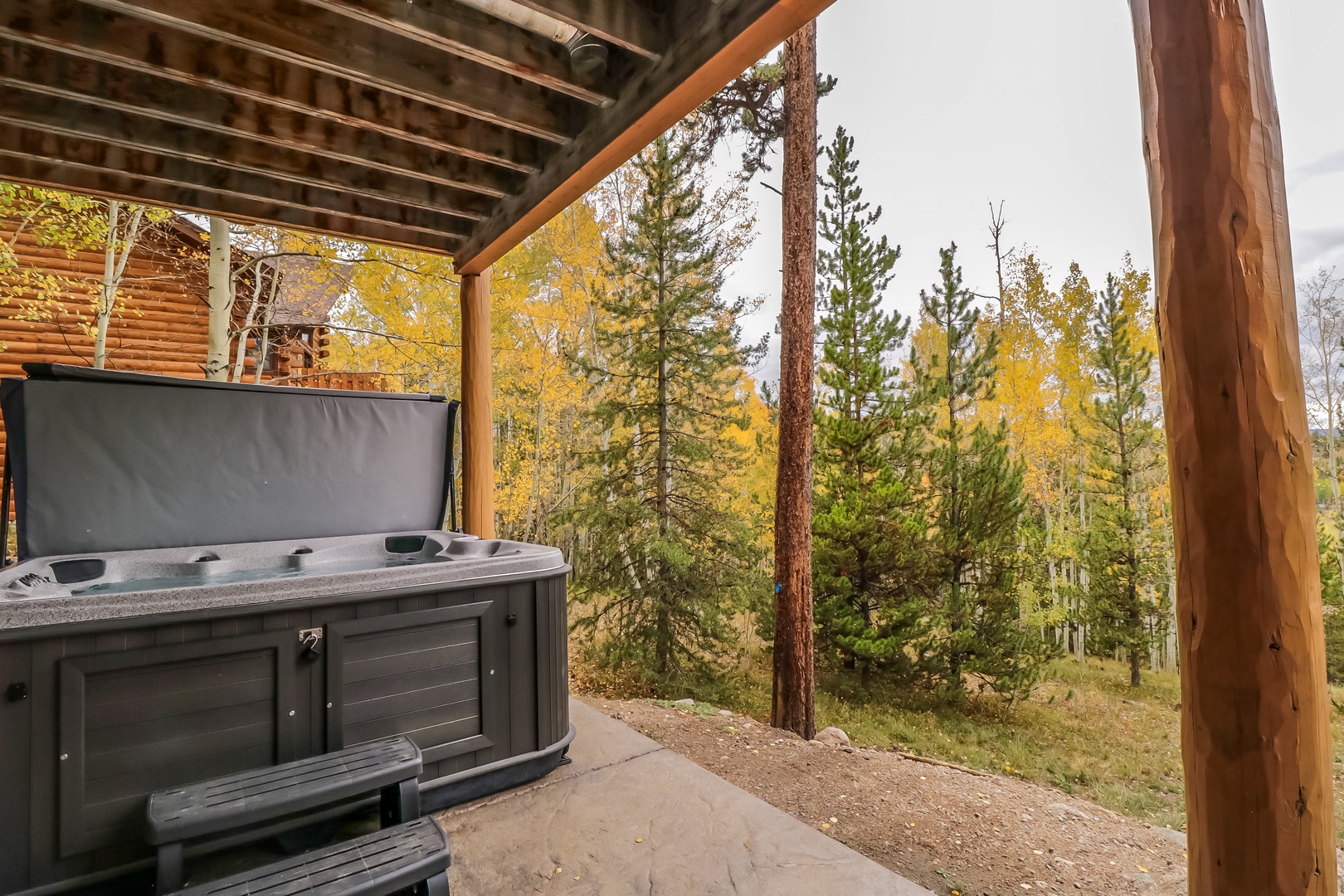 Soak in your private hot tub surrounded by towering pines and golden aspens. The covered deck offers peaceful mountain seclusion and fresh forest air—your own tranquil retreat at the end of the day.