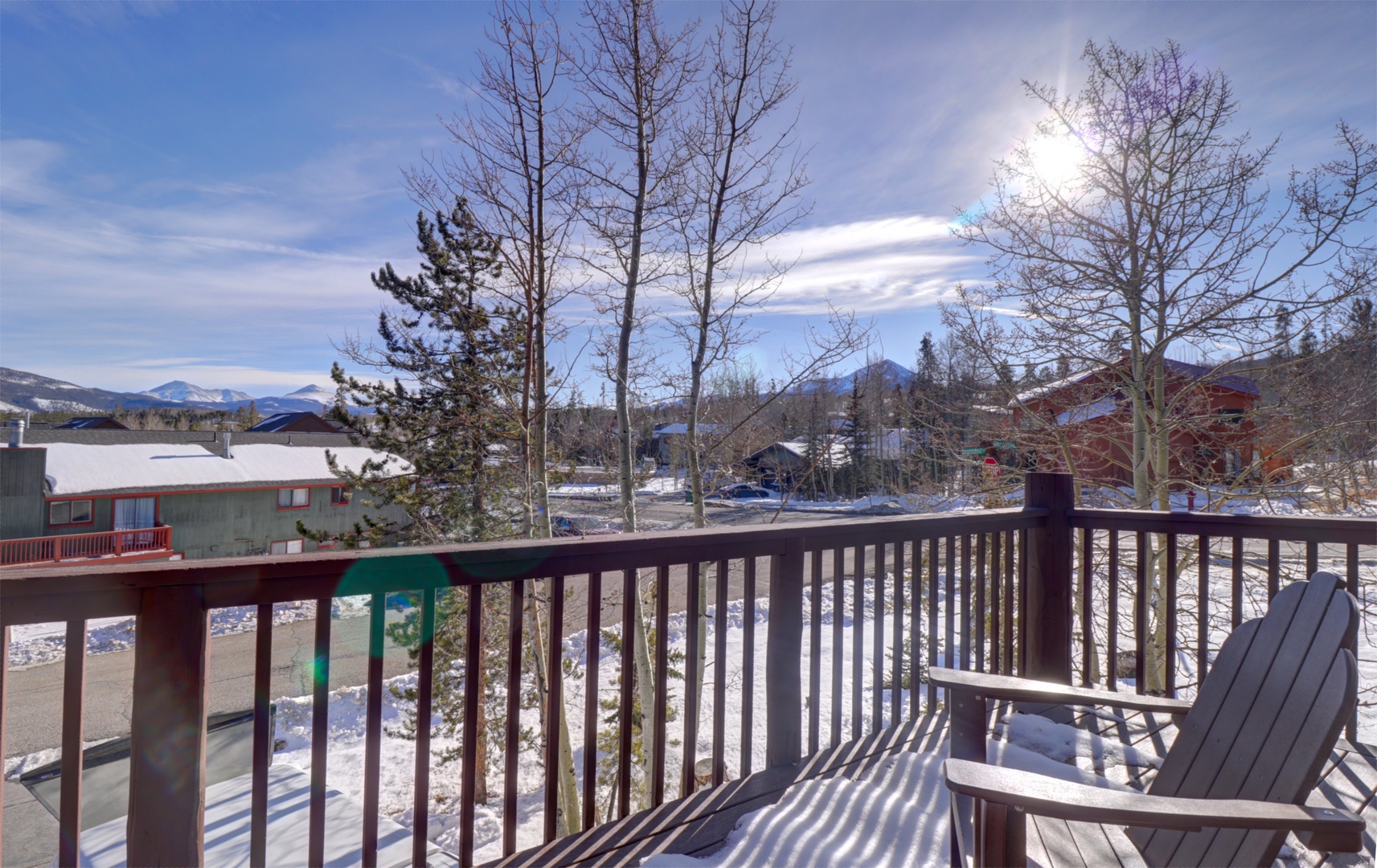 Enjoy your morning coffee on your private balcony, taking in the peaceful winter scenery and distant mountain views.
