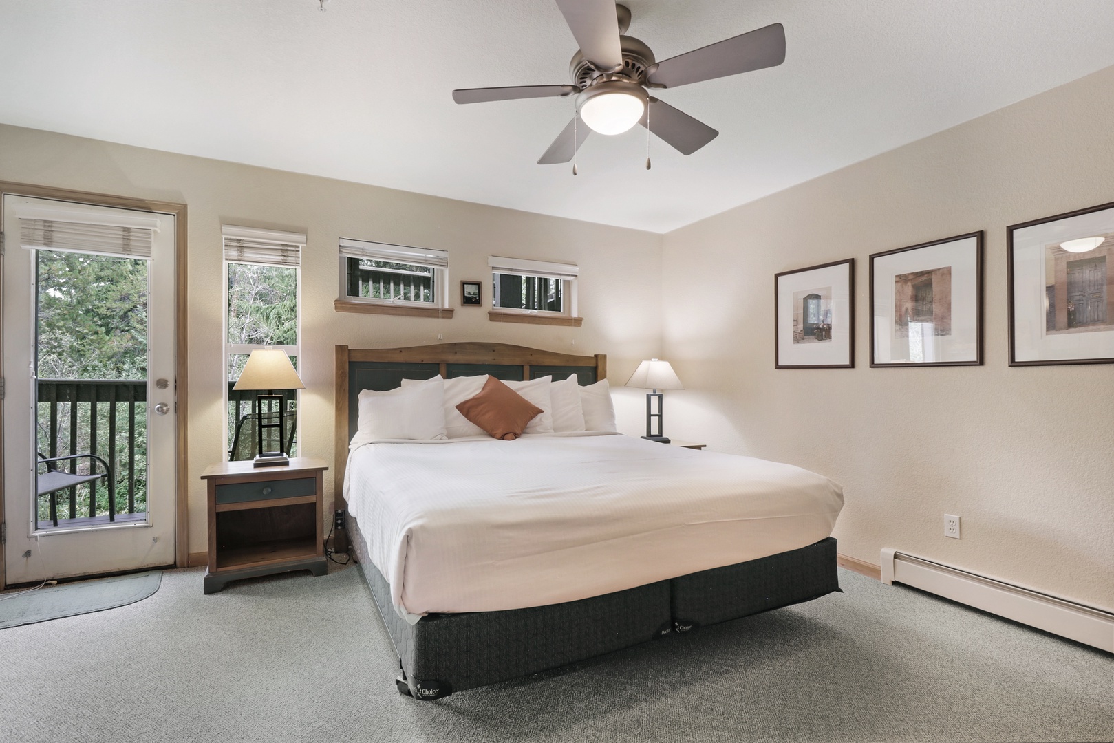 Sink into crisp linens and peaceful comfort in your private bedroom retreat. The balcony door invites gentle breezes and forest views, while soft lighting sets the perfect mood for unwinding after your day's adventures.