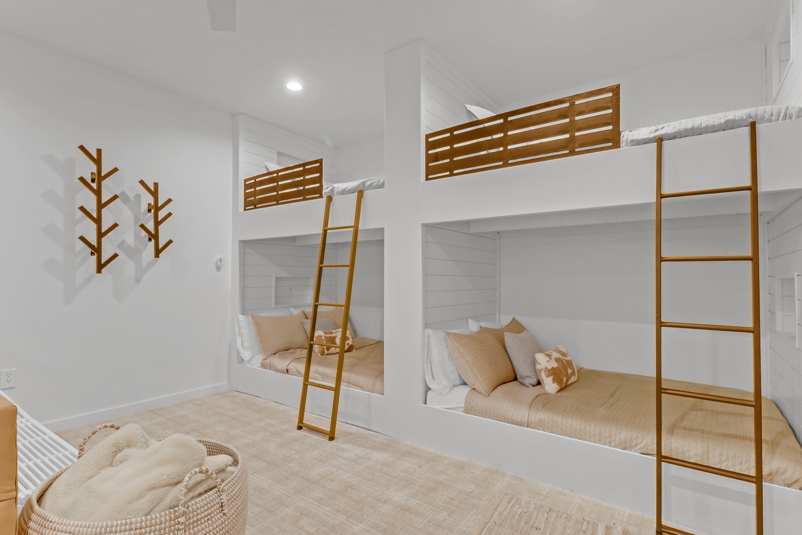 Your cozy bunk room features custom-built beds with warm wood accents and soft linens, perfect for family adventures and restful nights.