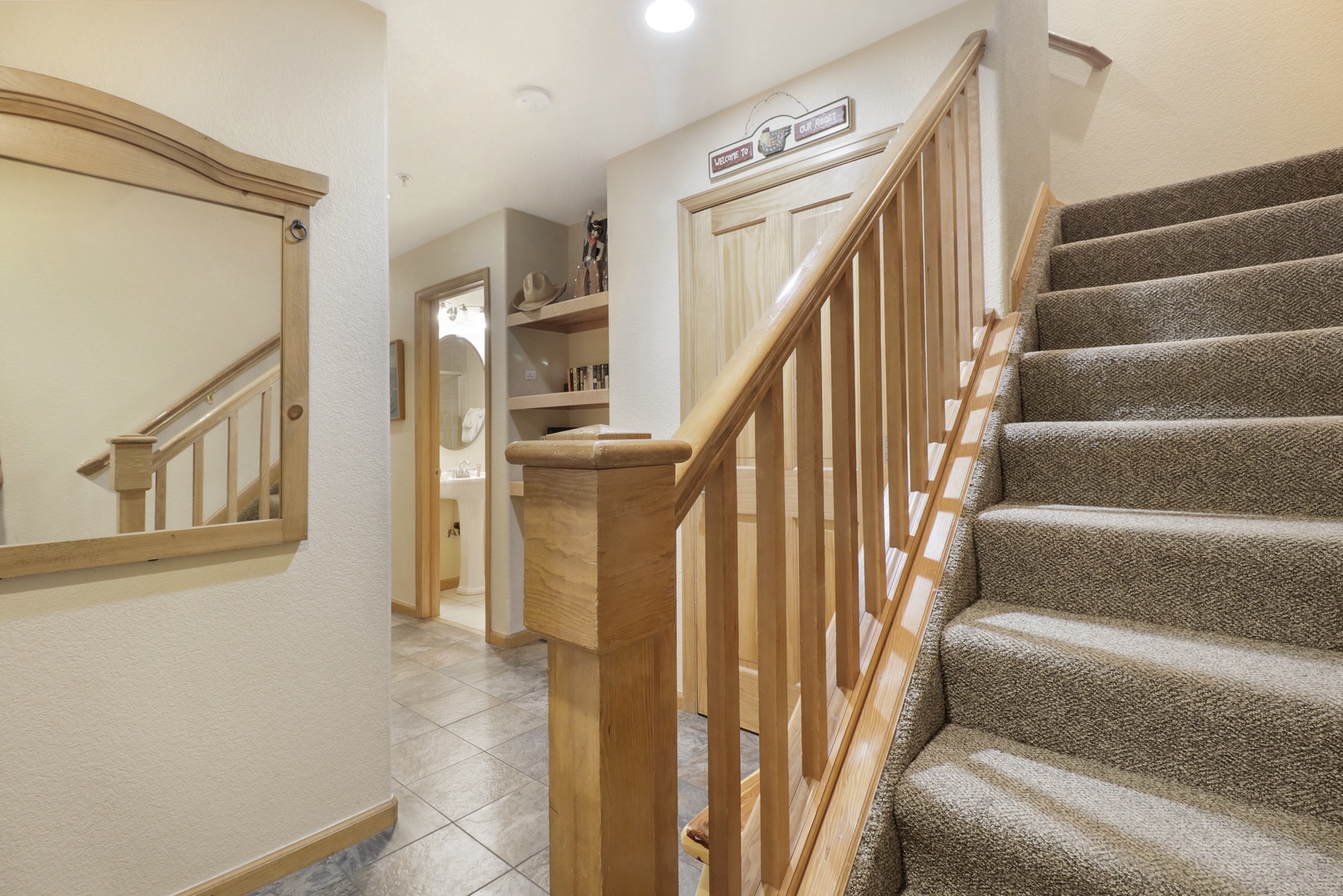 Welcome to your home away from home. This bright, open entryway greets you with warm wood tones and plenty of natural light filtering through the space.